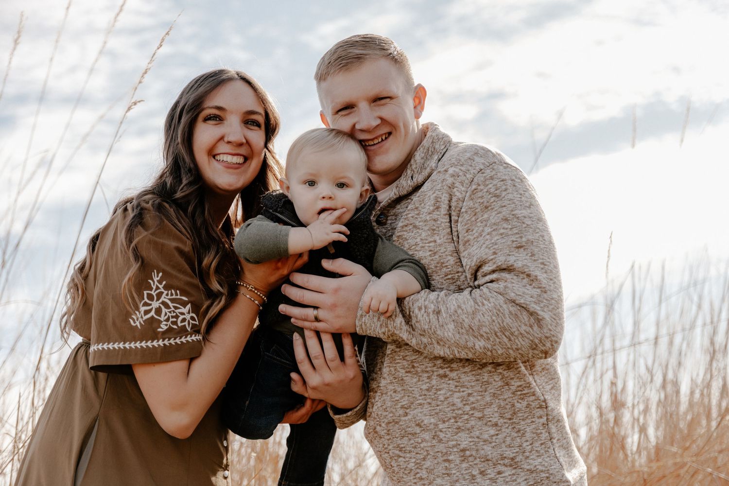 Intimate family portrait series in natural outdoor lighting.