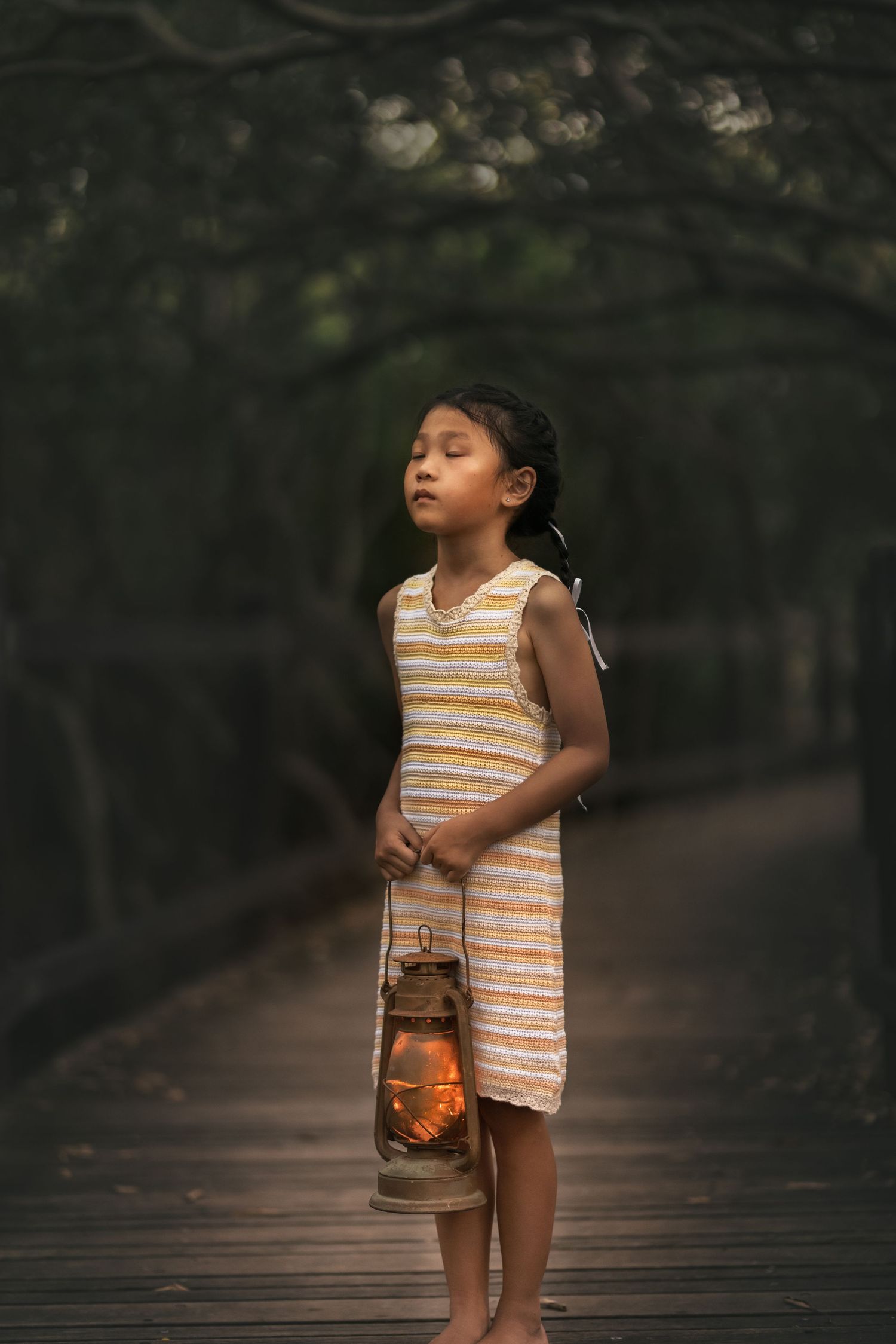 Ethereal storytelling photography - Child on forest bridge at sunset Brisbane