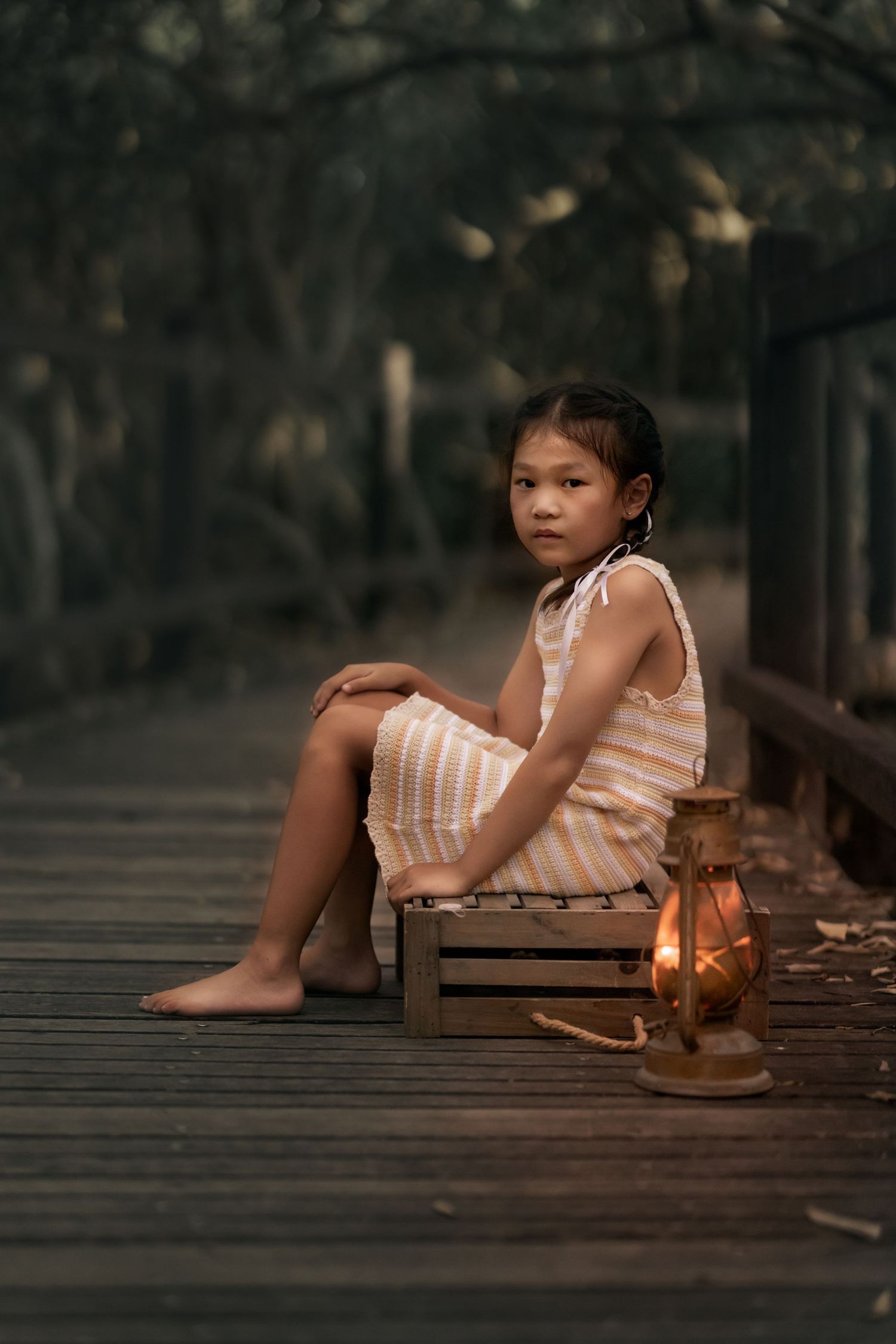 Classic storytelling photography - Child on wooden bridge with lantern Brisbane