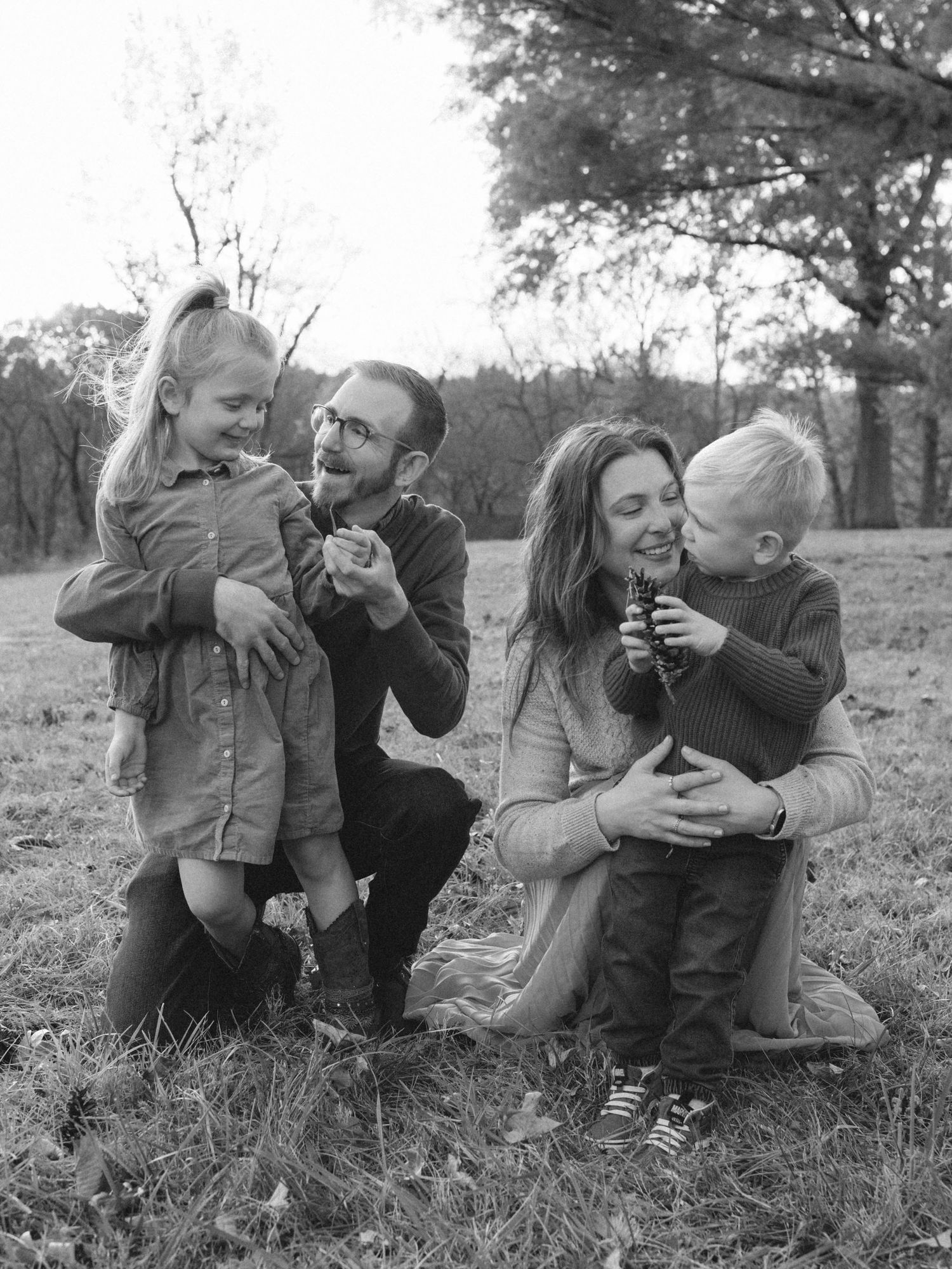 Parents hugging children in fall family photos- St. Louis lifestyle photography