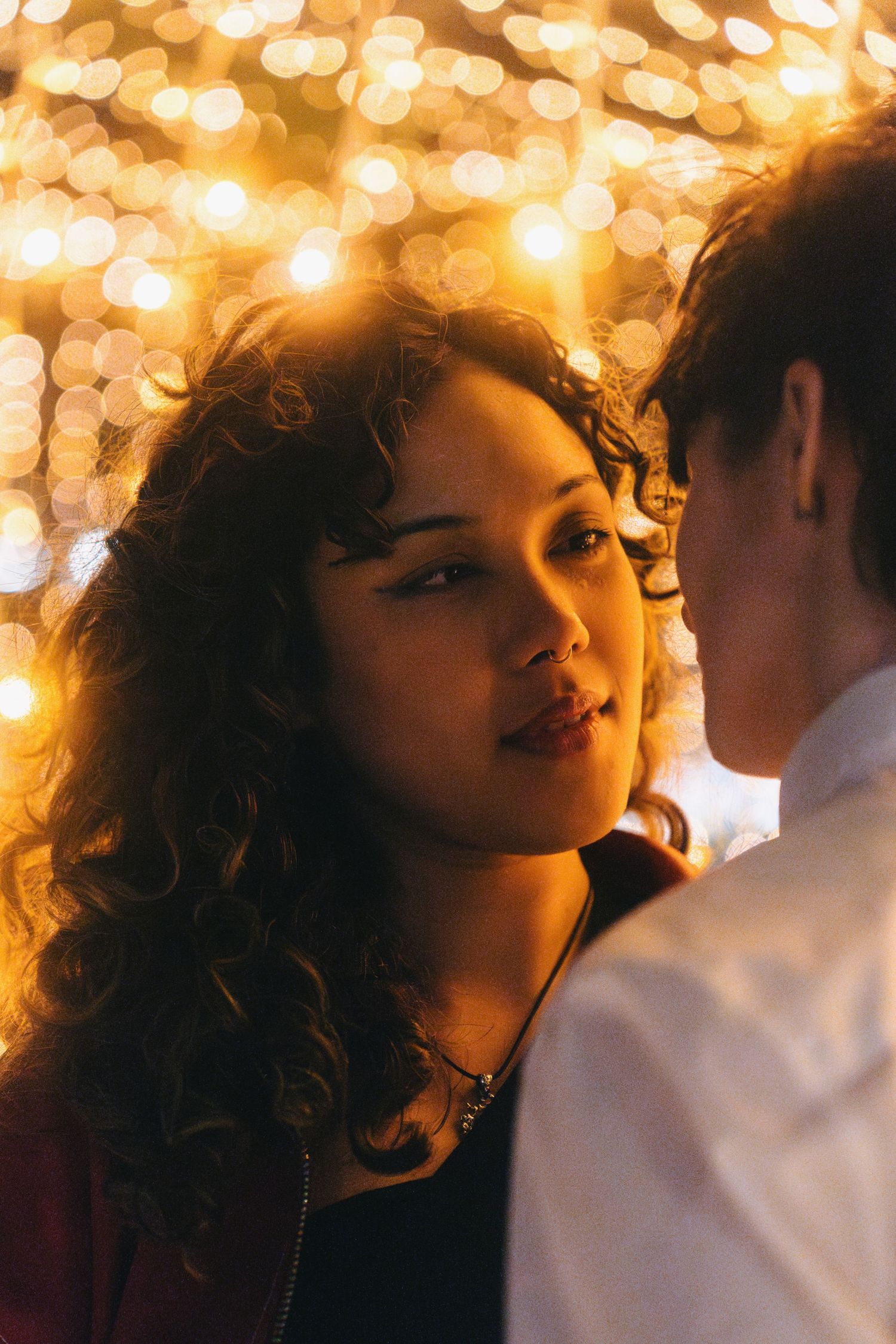Romantic evening scene with warm bokeh lights creating dreamy atmosphere.