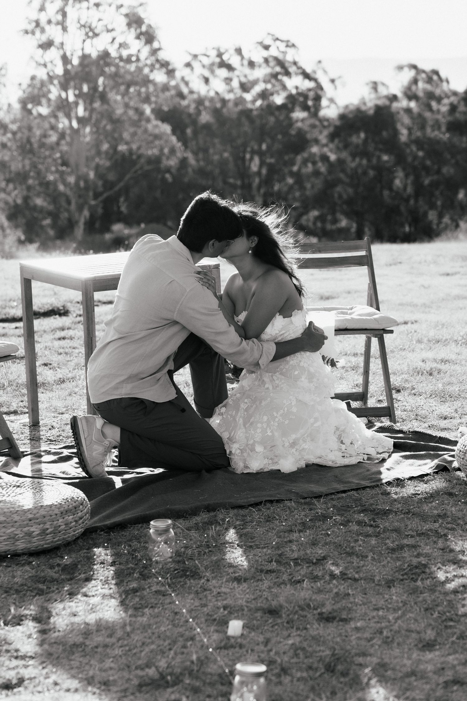 An intimate moment shared during a romantic outdoor proposal.