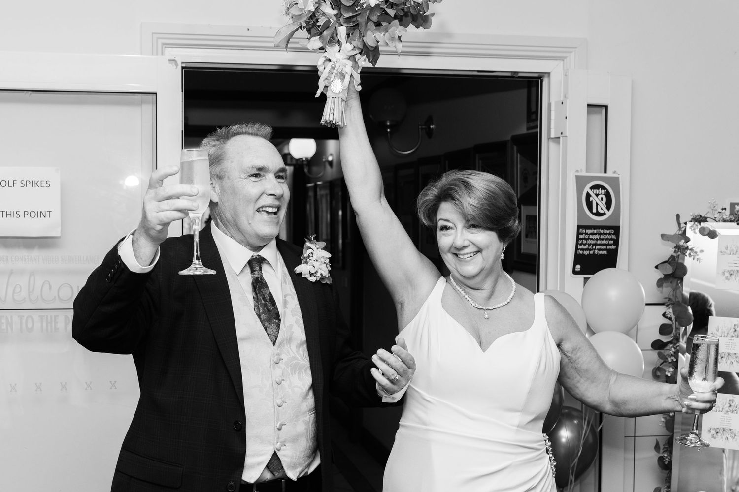 Wedding reception candid moments showing celebration and joy indoors.