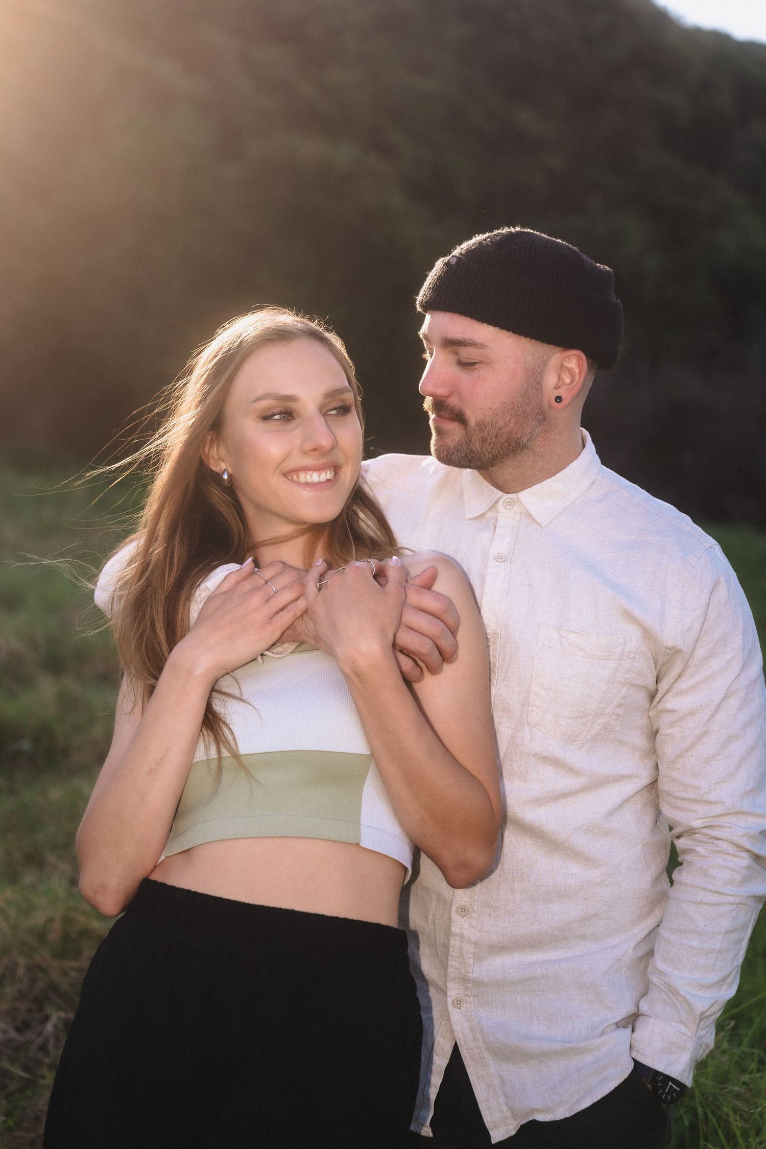 Intimate couple photos showing tender moments between partners in golden sunlight.