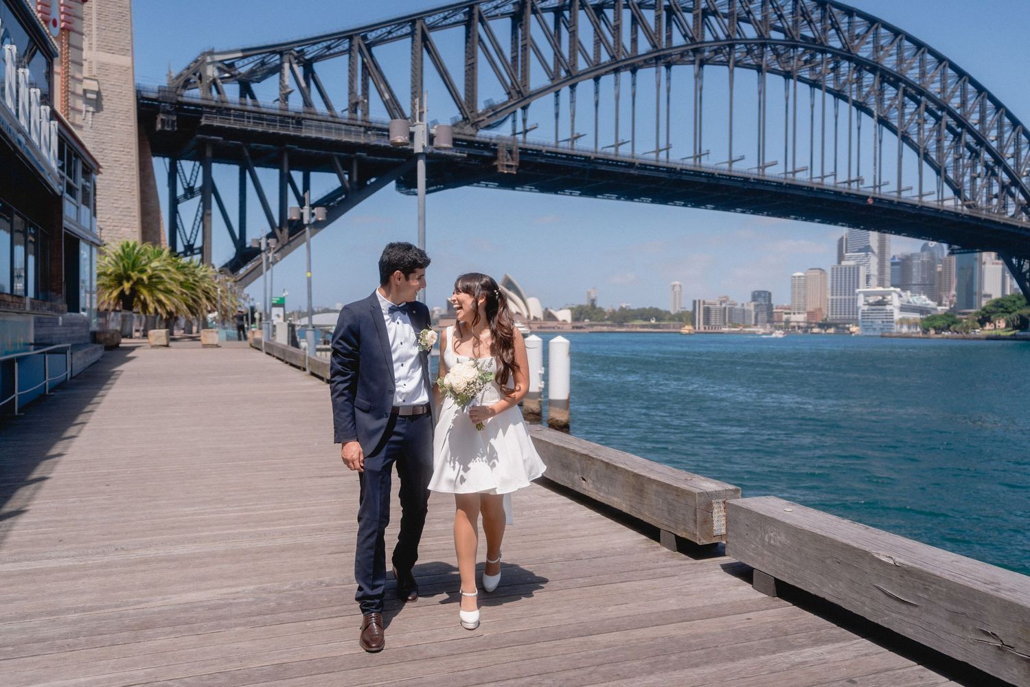 Wedding photography session along Sydney Harbour with iconic bridge views.