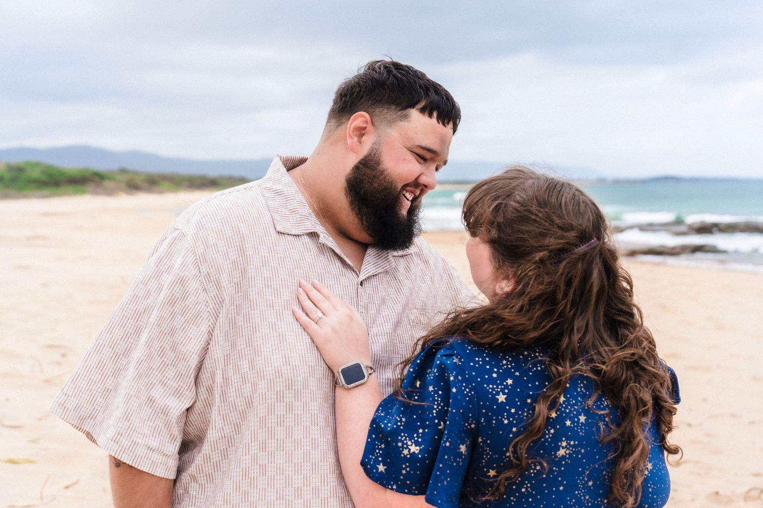 Emotional beach proposal moment captured in sequence.