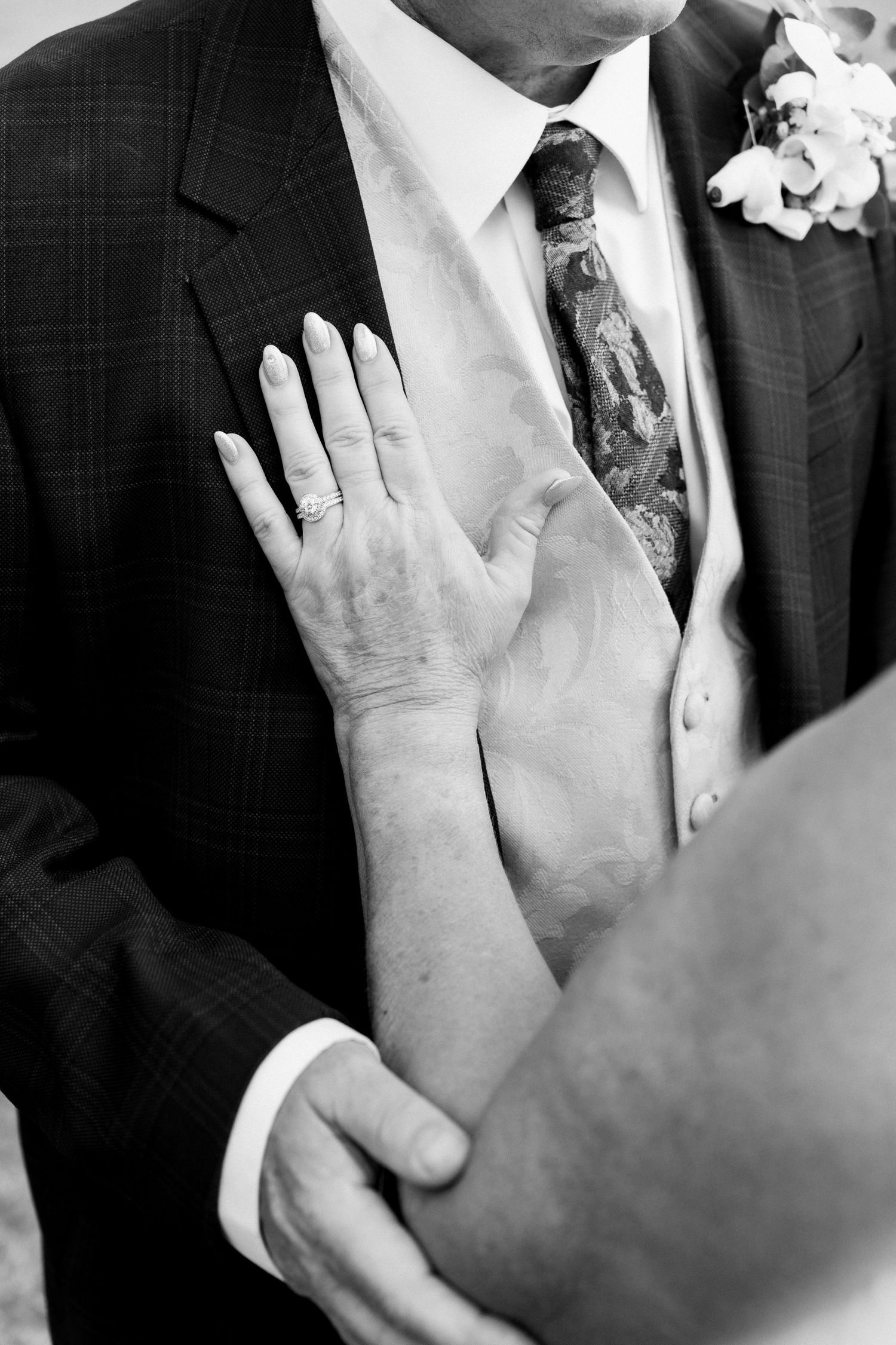 Close-up shots of hands touching and caressing during a wedding ceremony.