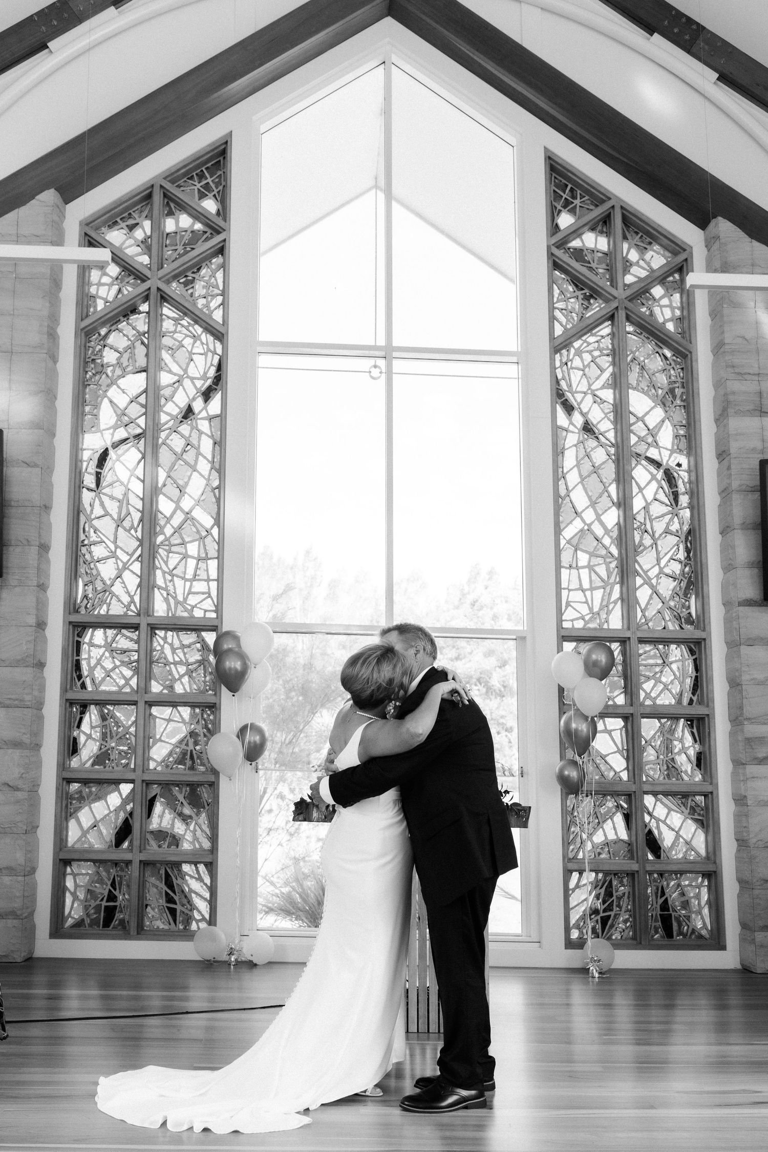 Dancing sequence in a chapel with large windows and natural light.