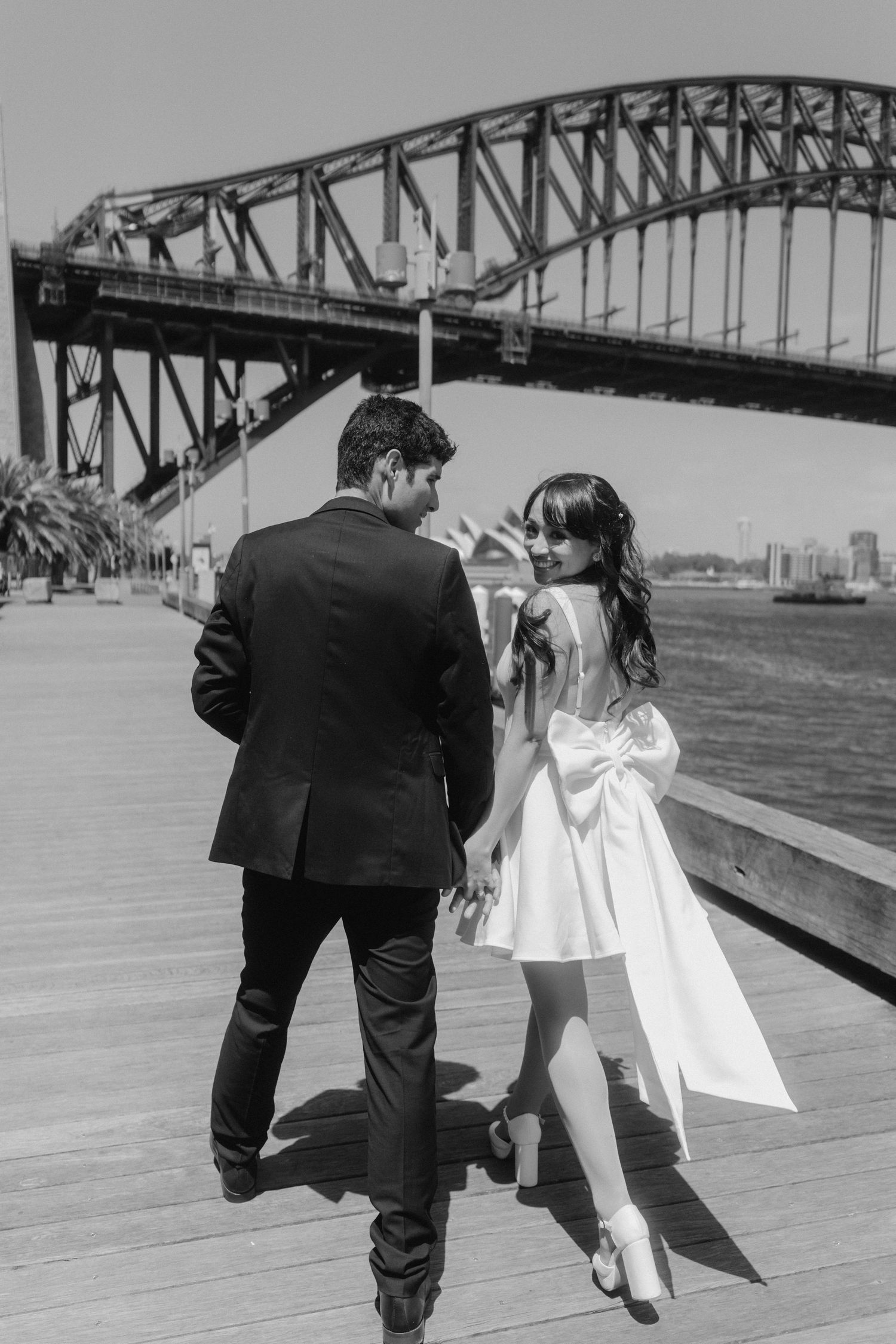 Black and white wedding photography sequence with Sydney Harbour Bridge backdrop.