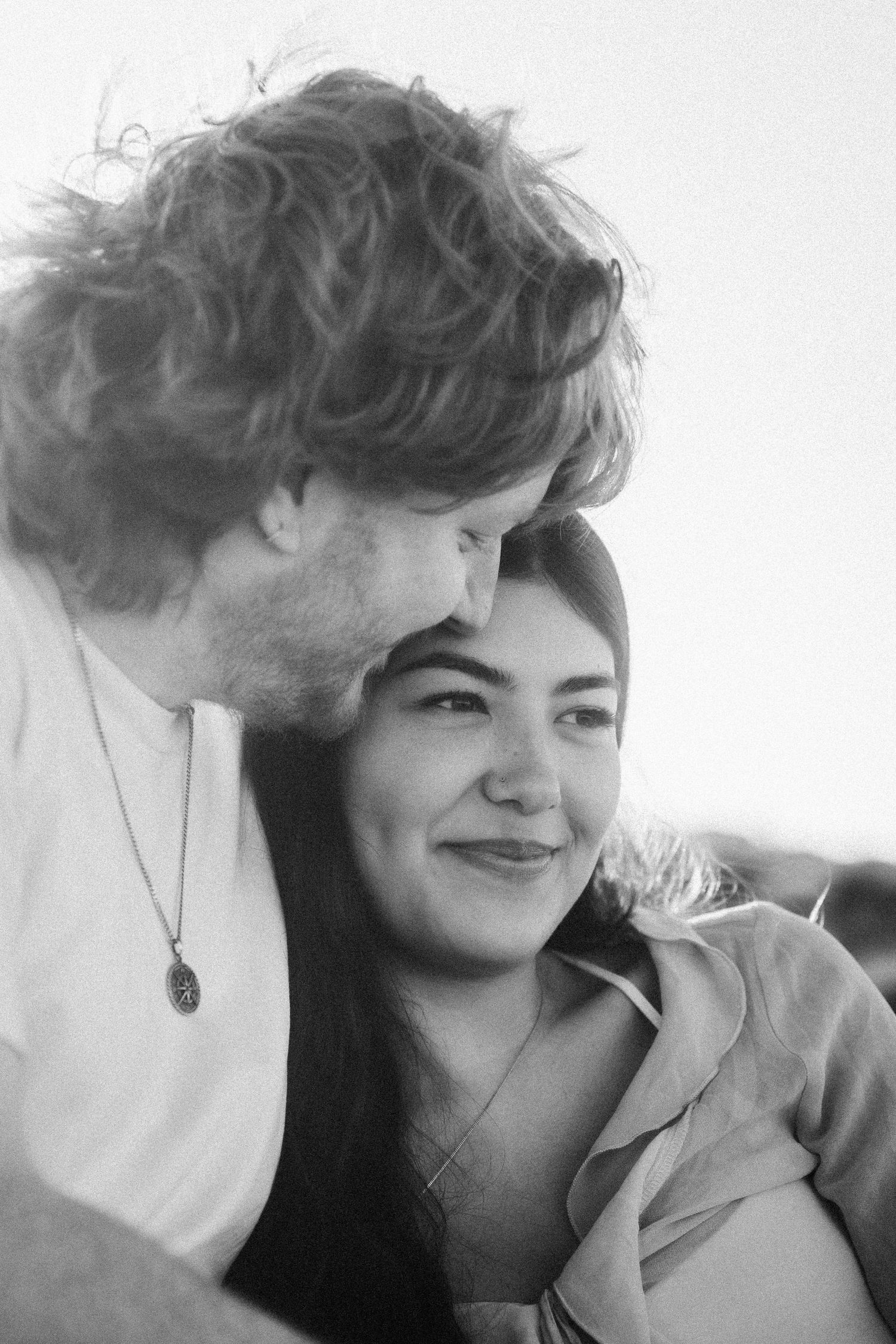Black and white close-up portraits capturing intimate moments between a couple.