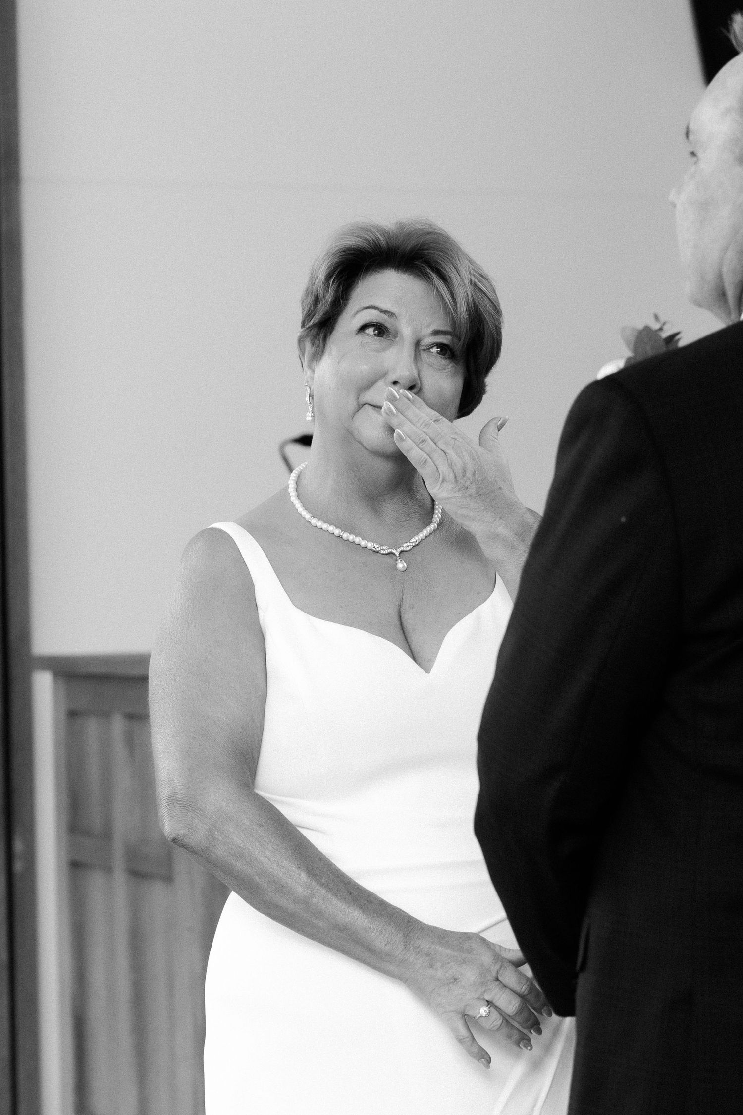 Wedding couple in black and white sharing an intimate moment.