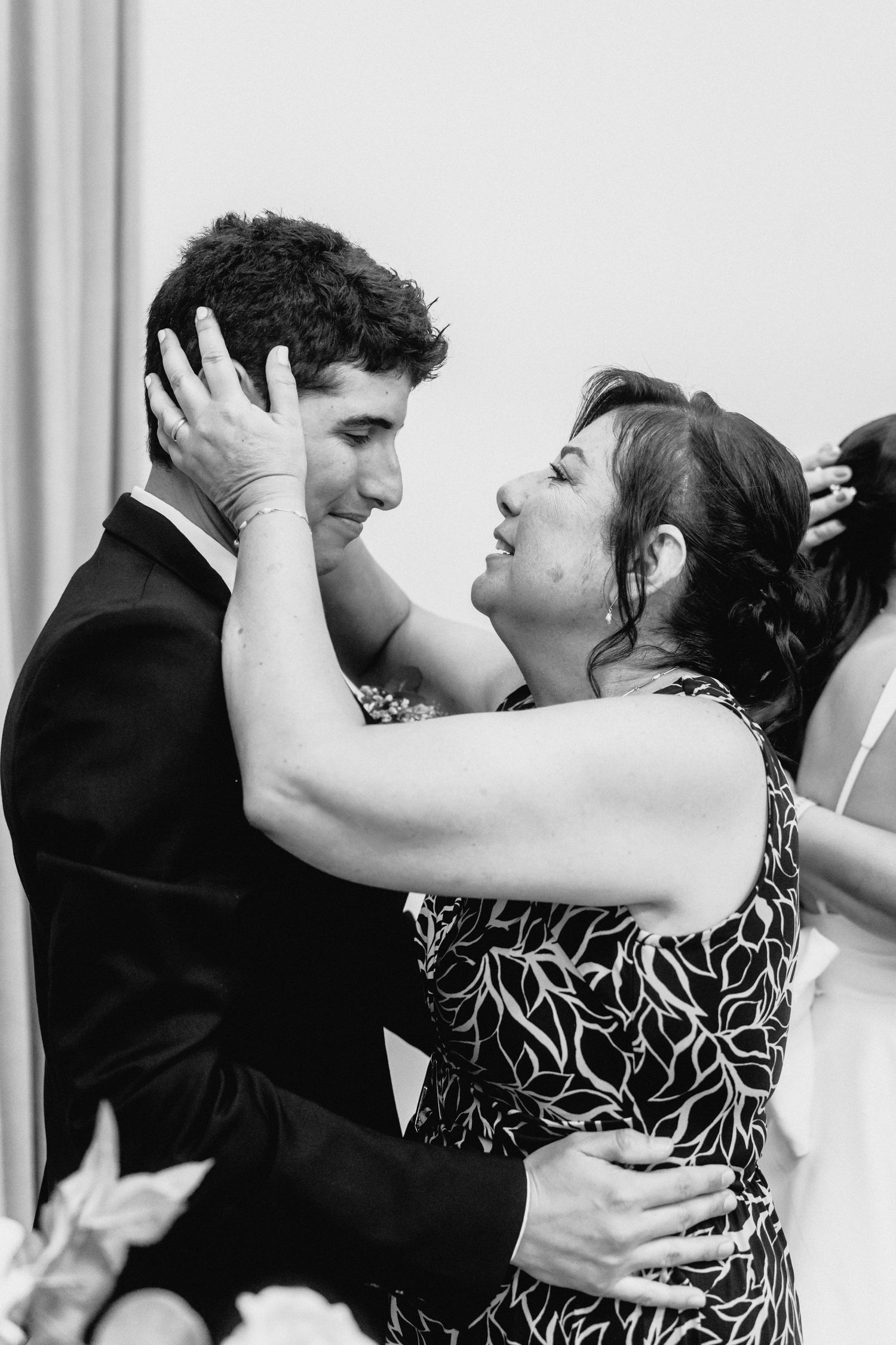 A couple embraces in a passionate dance sequence at their wedding celebration.