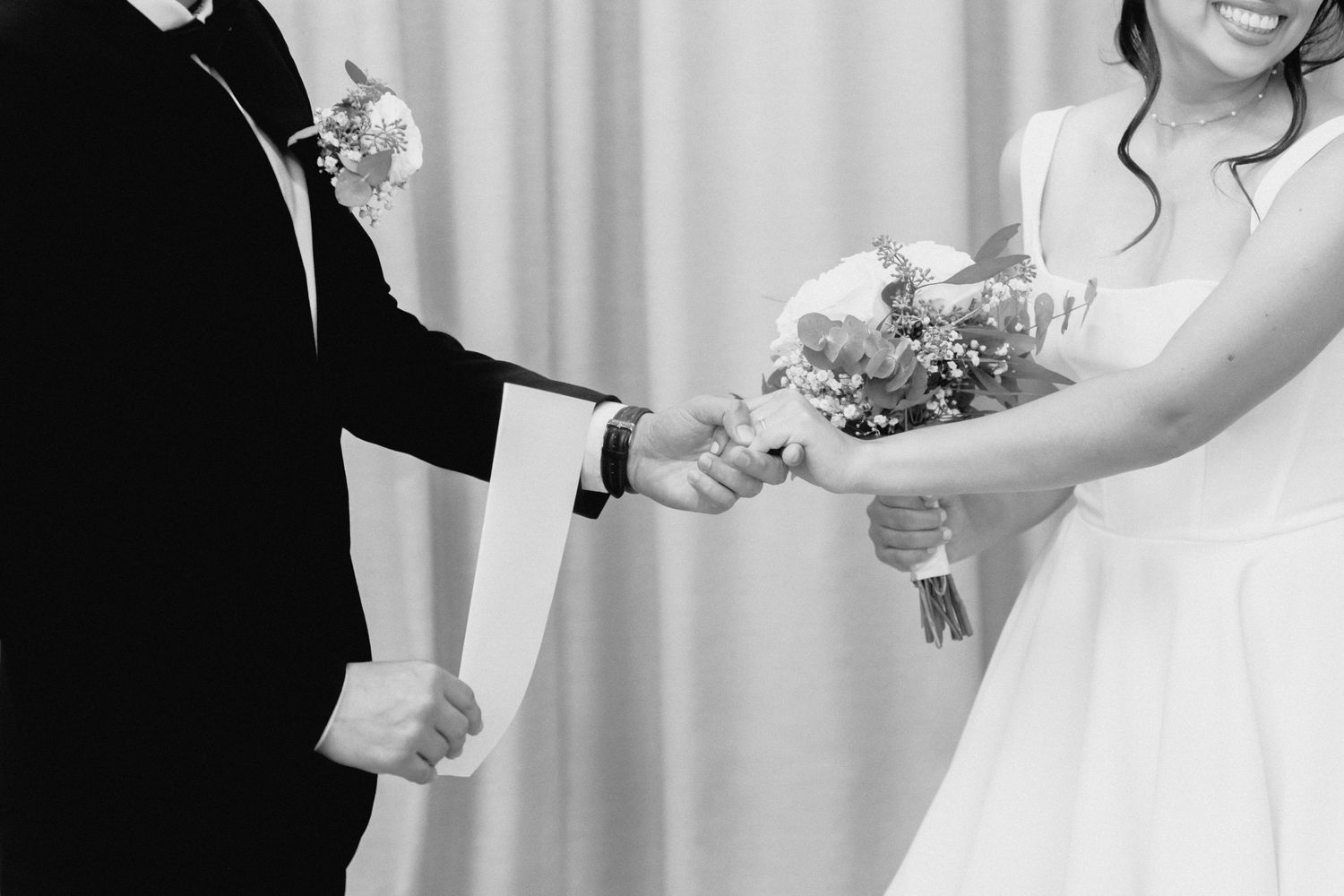 Emotional first look between couple during wedding ceremony with floral bouquet.