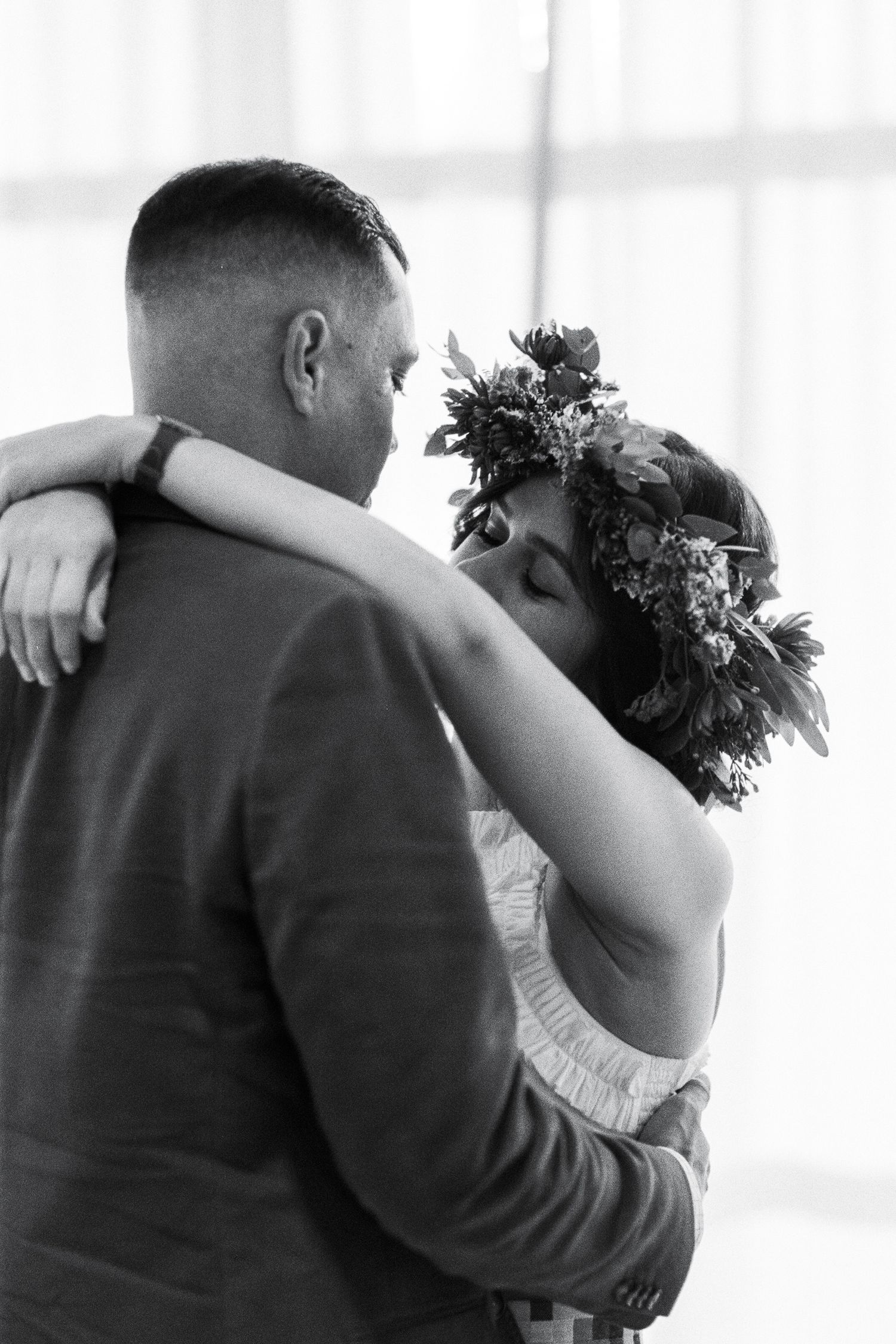 Intimate dance moments captured in soft window lighting.