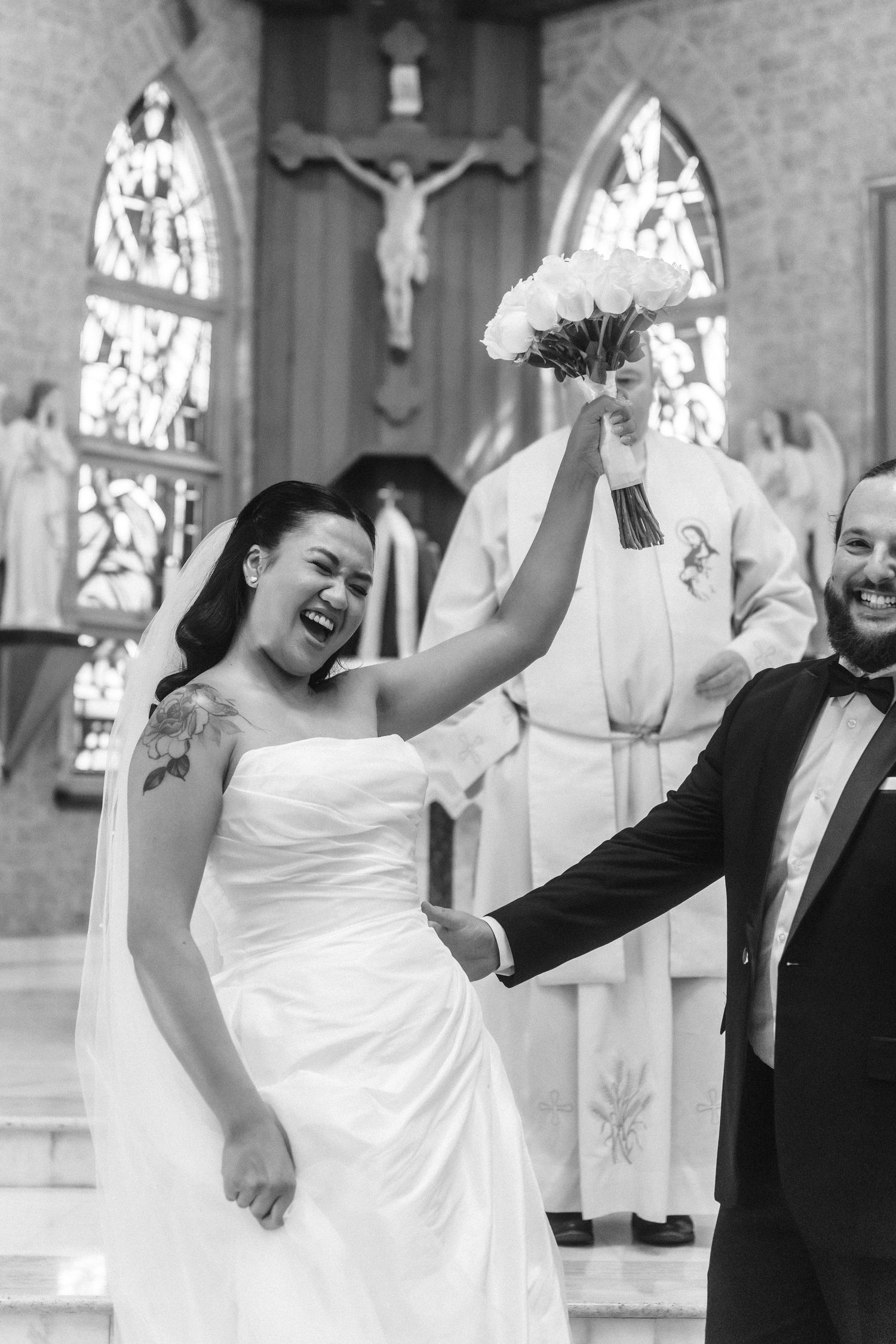 Celebratory dance moves during wedding ceremony in church sanctuary.