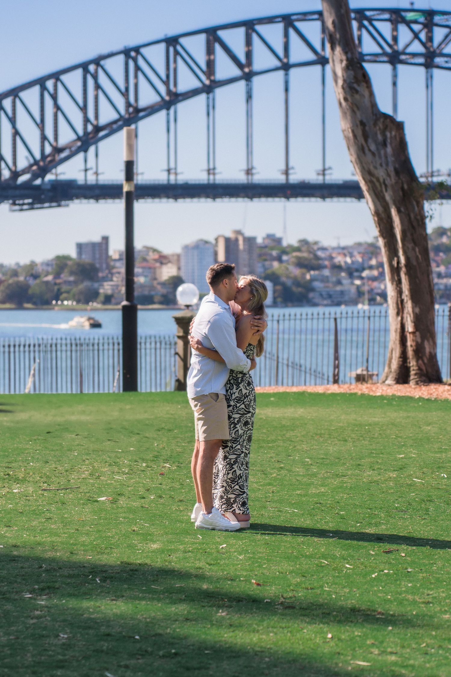 A marriage proposal captured with Sydney Harbour Bridge creating a stunning backdrop.