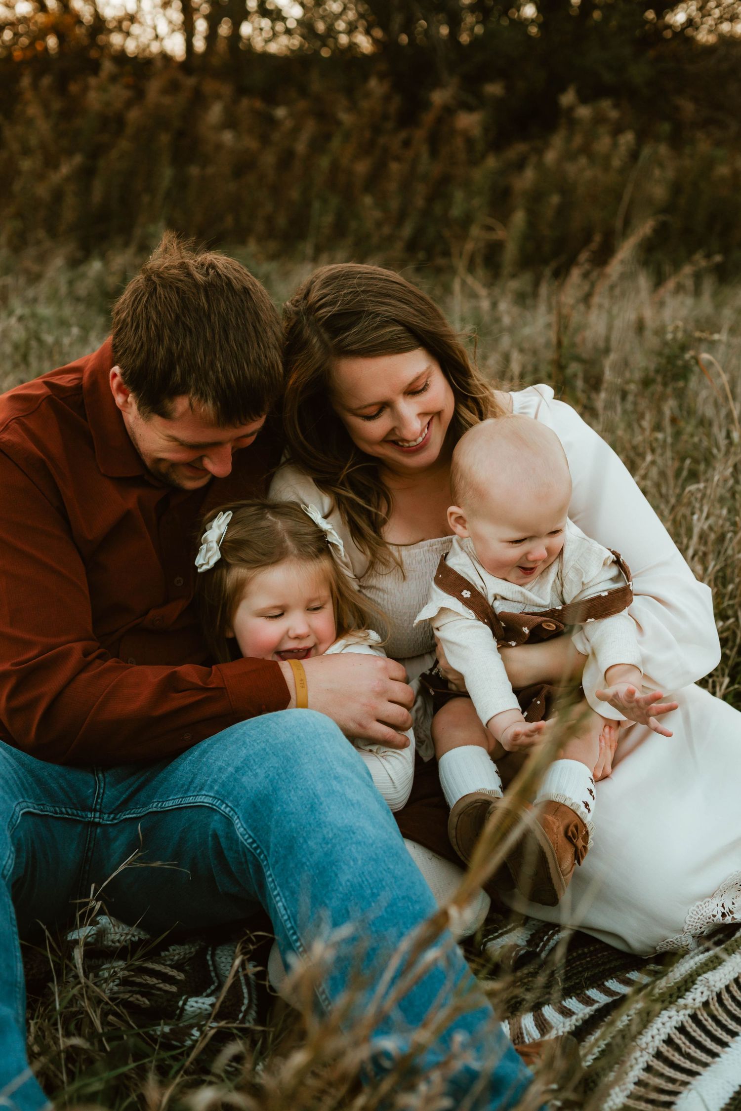 Family of 4 in grassy field Southeast Minnesota