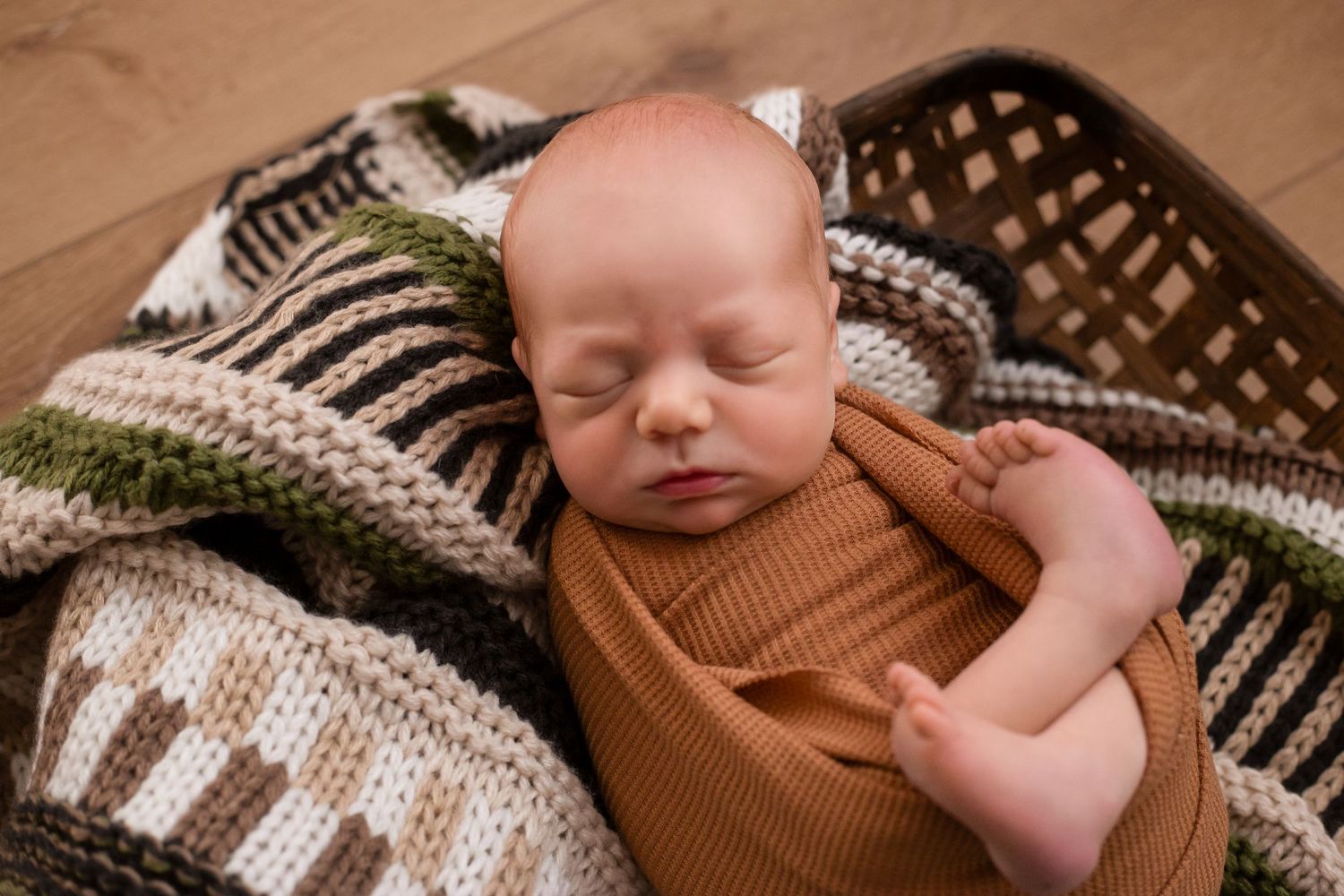 Newborn swaddled in basket Southeast Minnesota