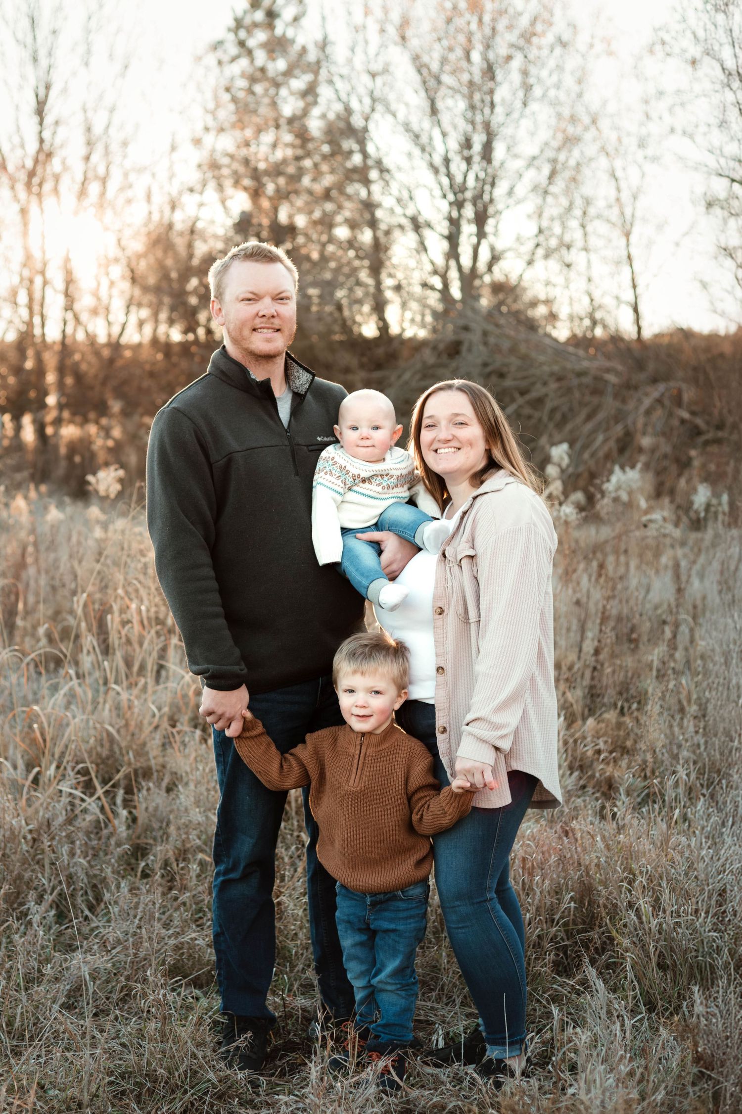 Family of 4 in grassy field Southeast Minnesota