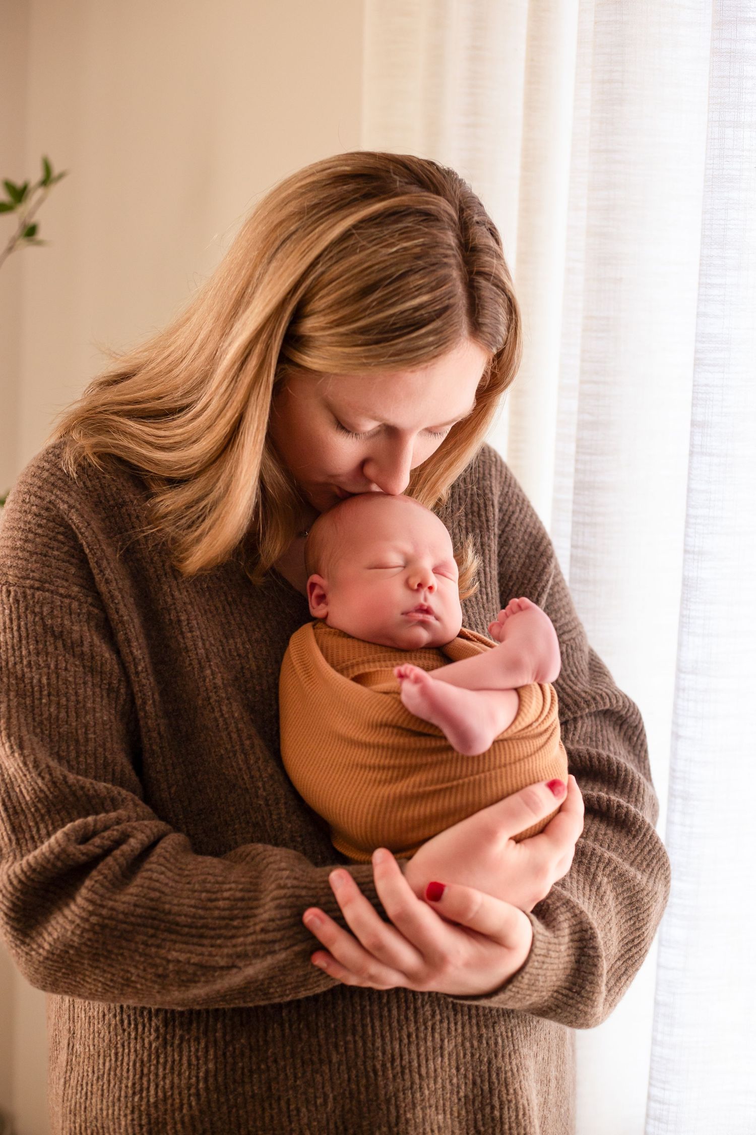 Mom holding newborn son Southeast Minnesota