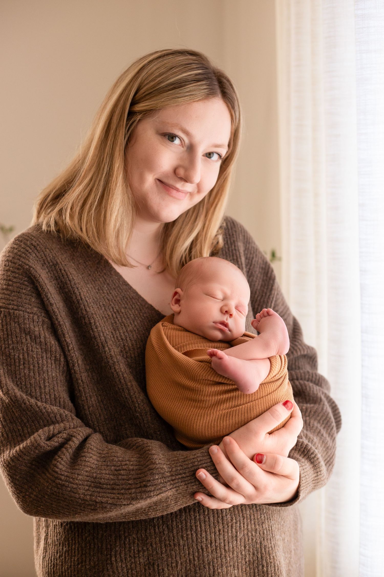 Mom holding newborn son Southeast Minnesota
