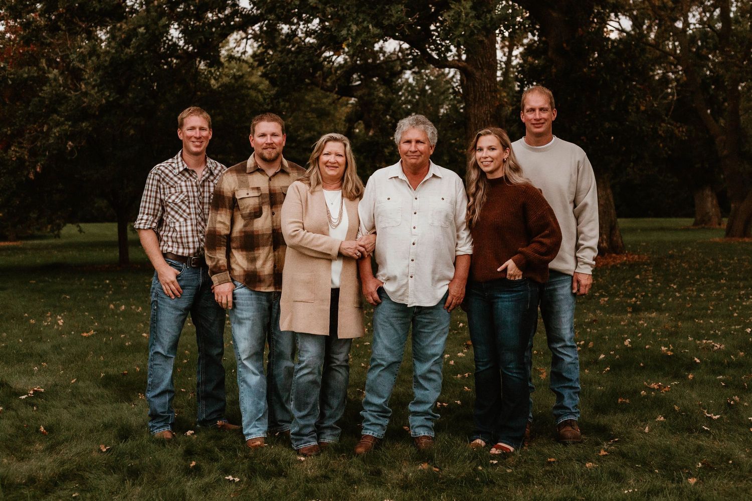 Grown family in grassy field Southeast Minnesota