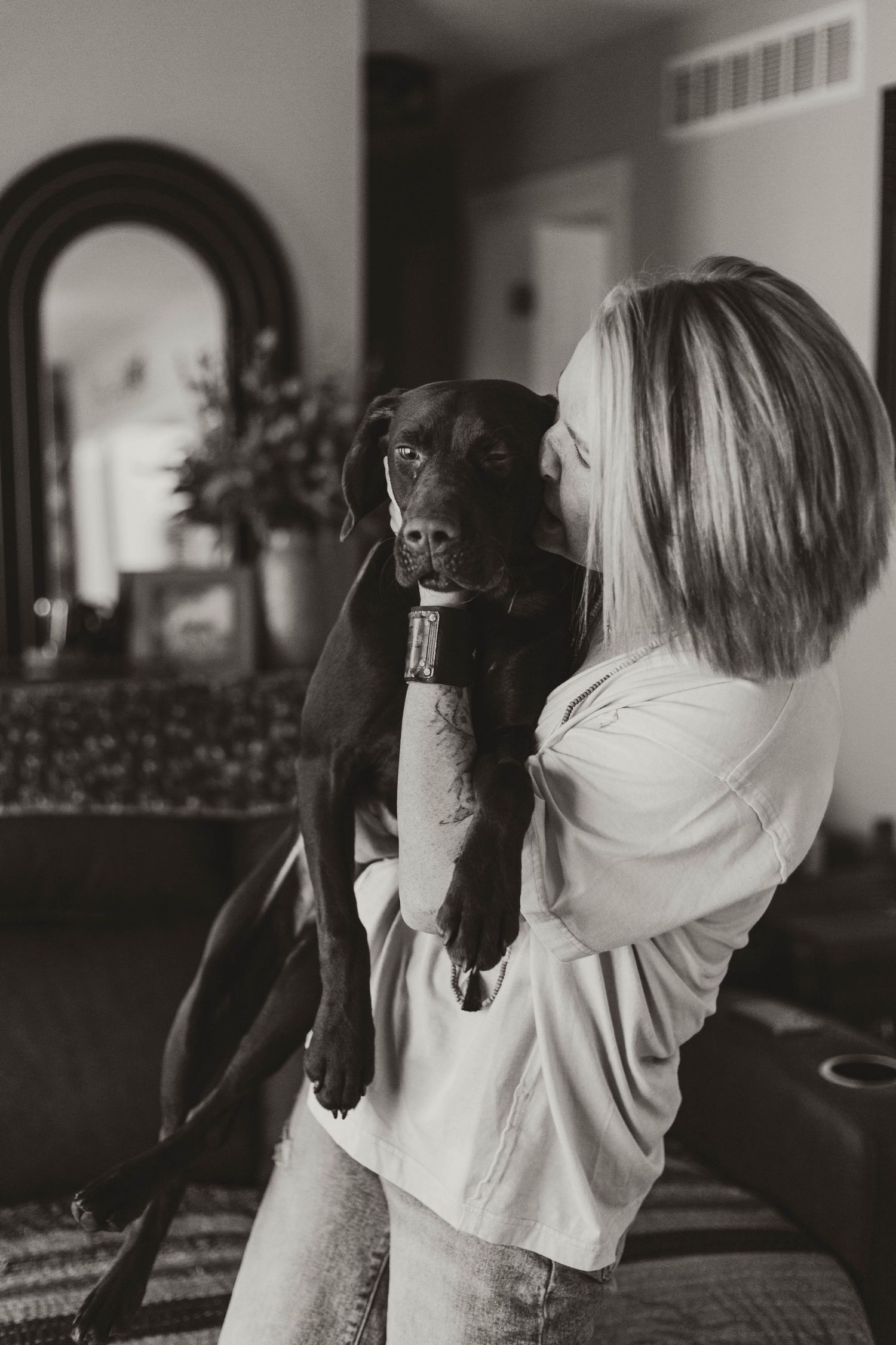 Owner kissing and holding dog southeast minnesota