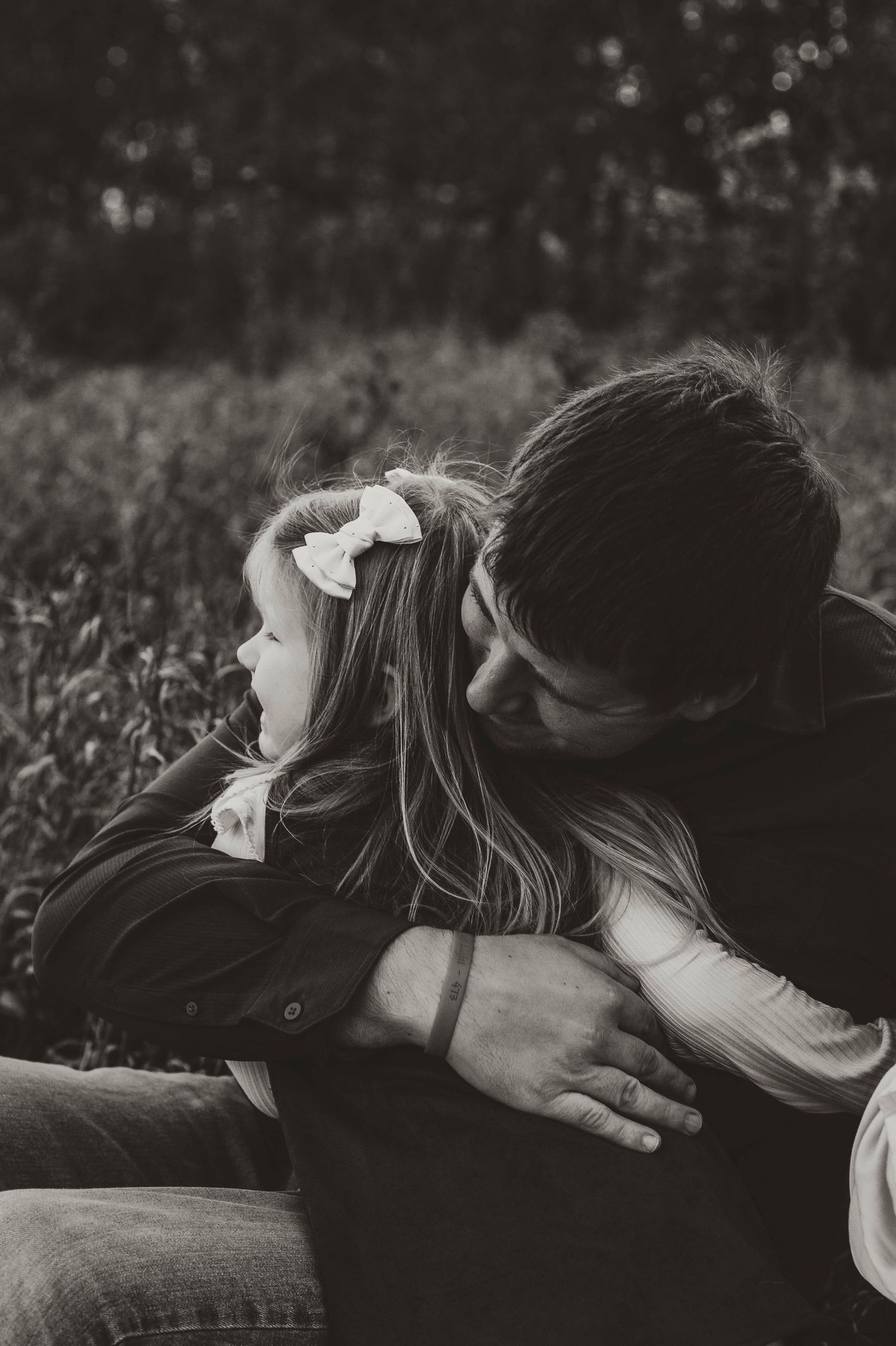 Dad and daughter in grassy field Southeast Minnesota