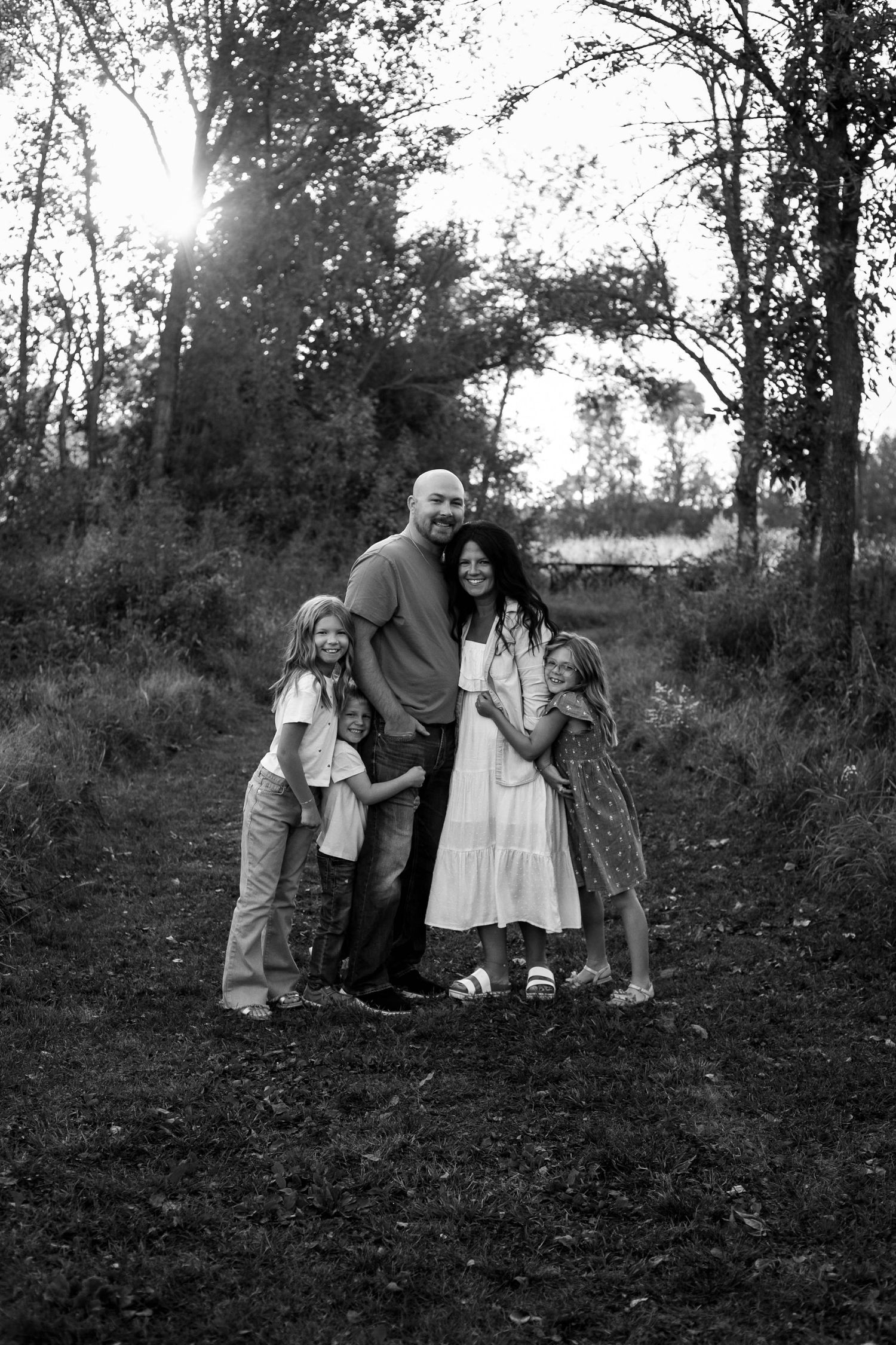 Family of 5 standing on grass trail in Southeast Minnesota