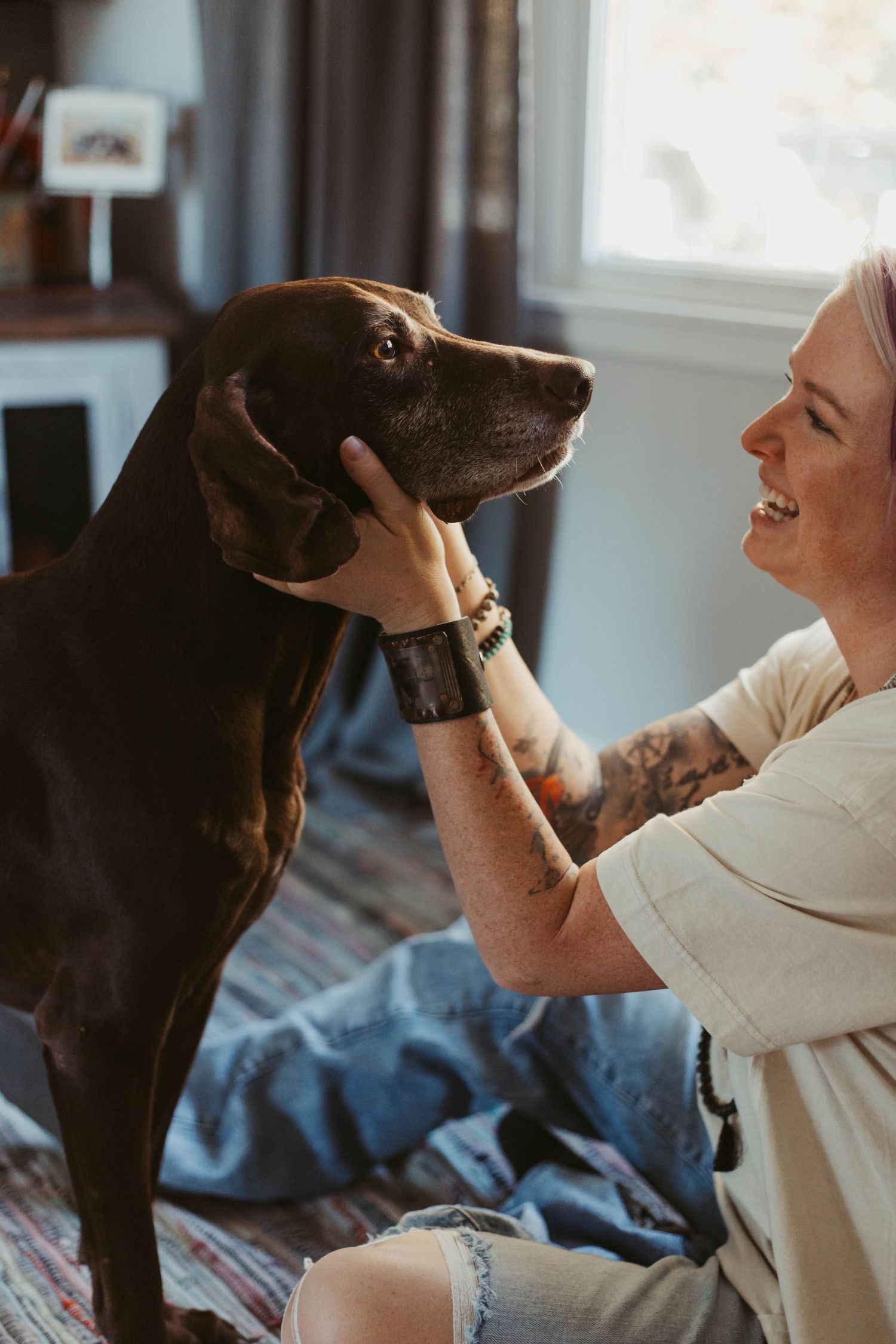 Girl petting dog in house southeast minnesota