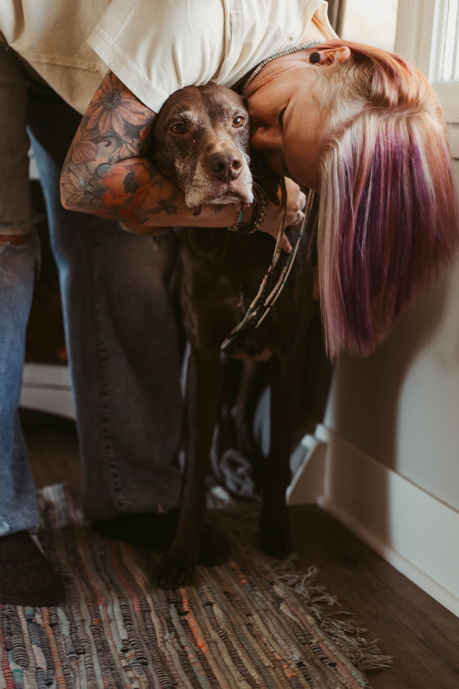 Girl kissing dog in house southeast minnesota