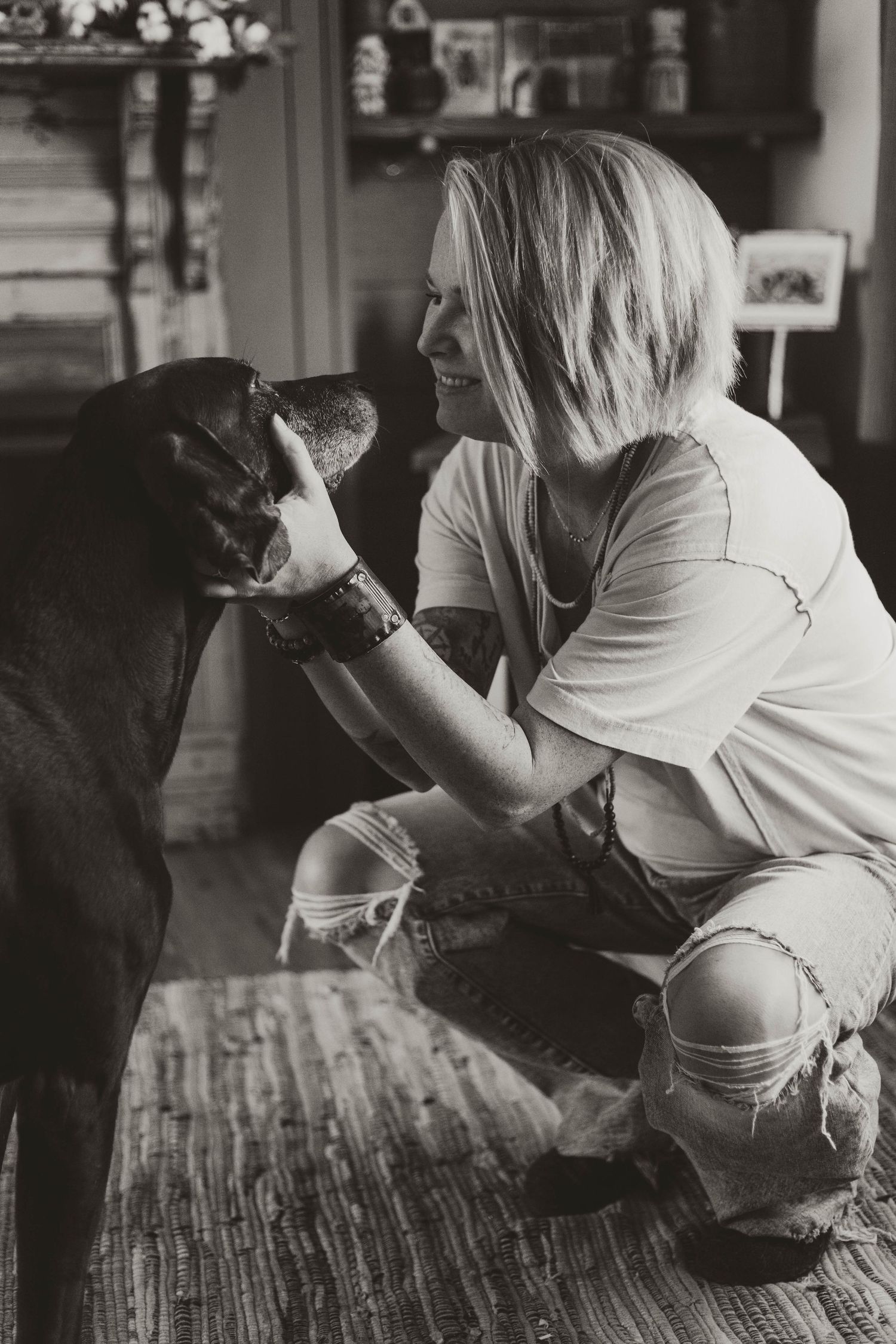 Girl loving on her pet dog in house in Southeast Minnesota
