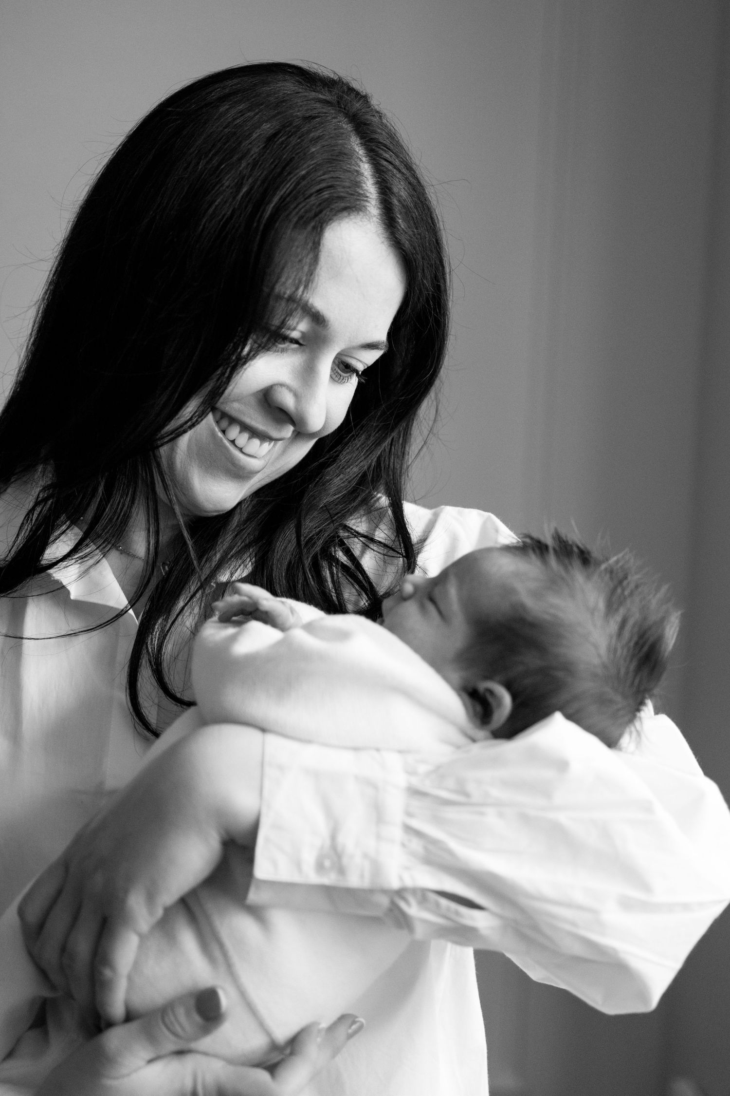 Black and white portrait of intimate playful moment between couple.