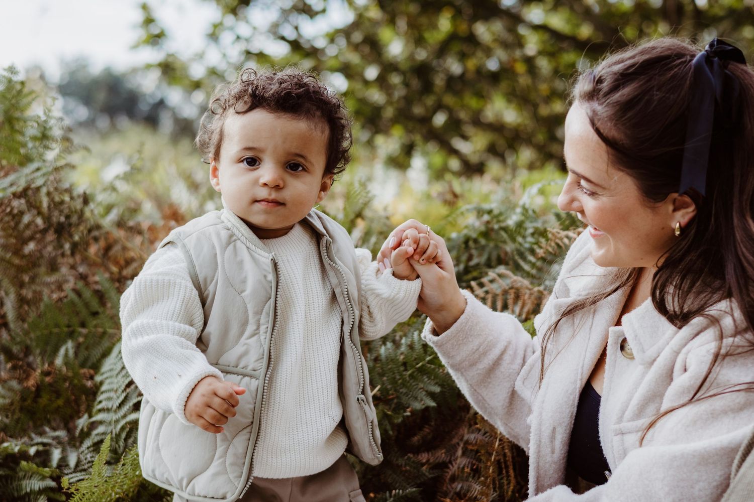 Candid outdoor family moments captured in a series of intimate black and white portraits.