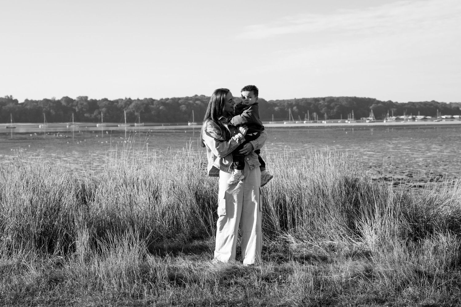 Panoramic series of family moments captured against a waterfront landscape.