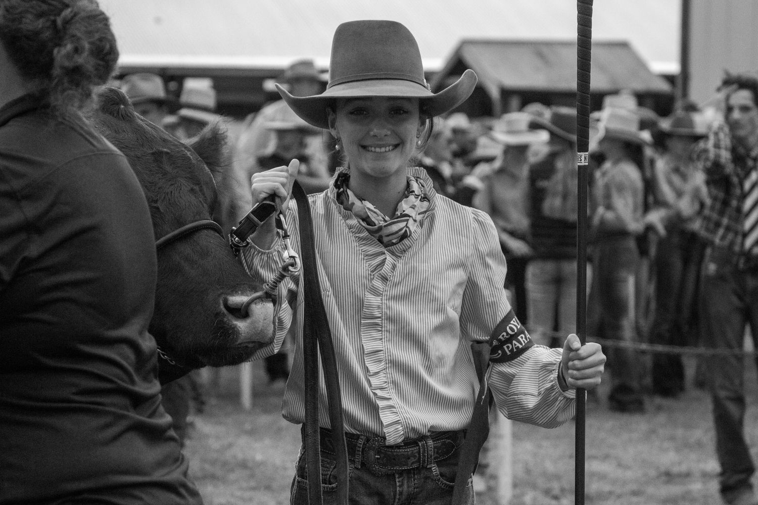 Black and white photograph of competitors at a rural agricultural show.