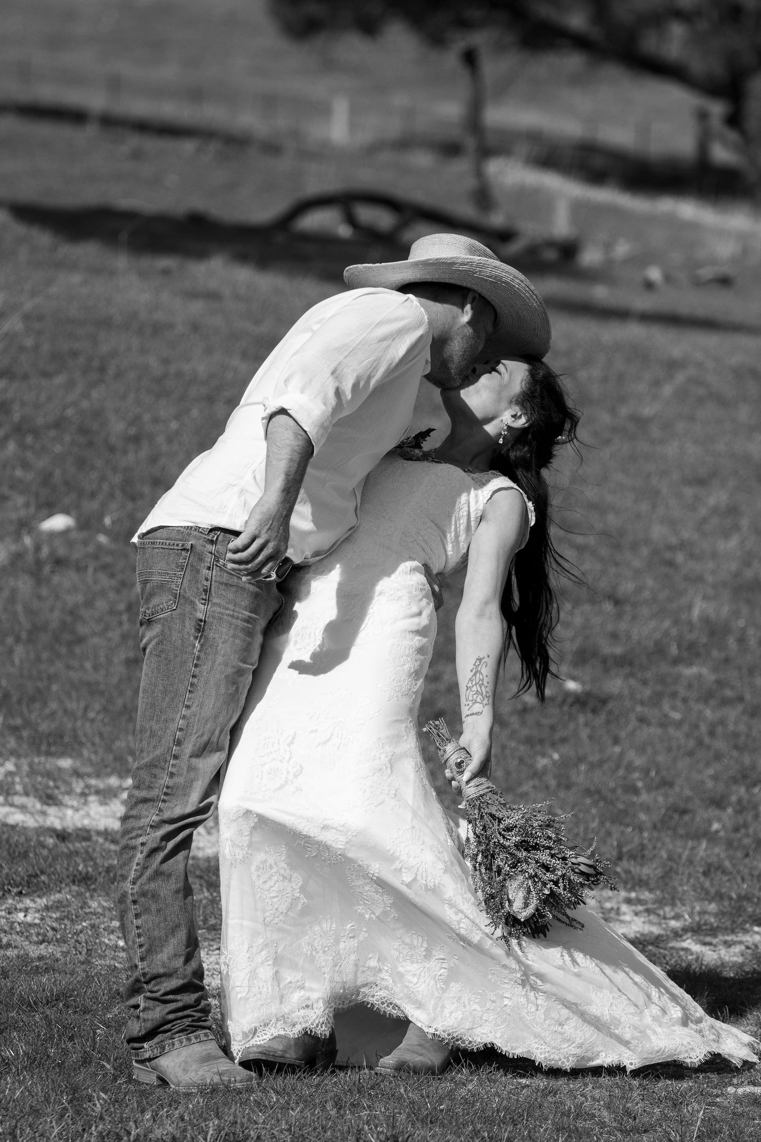 Black and white sequence showing a person in a white dress falling on grass.