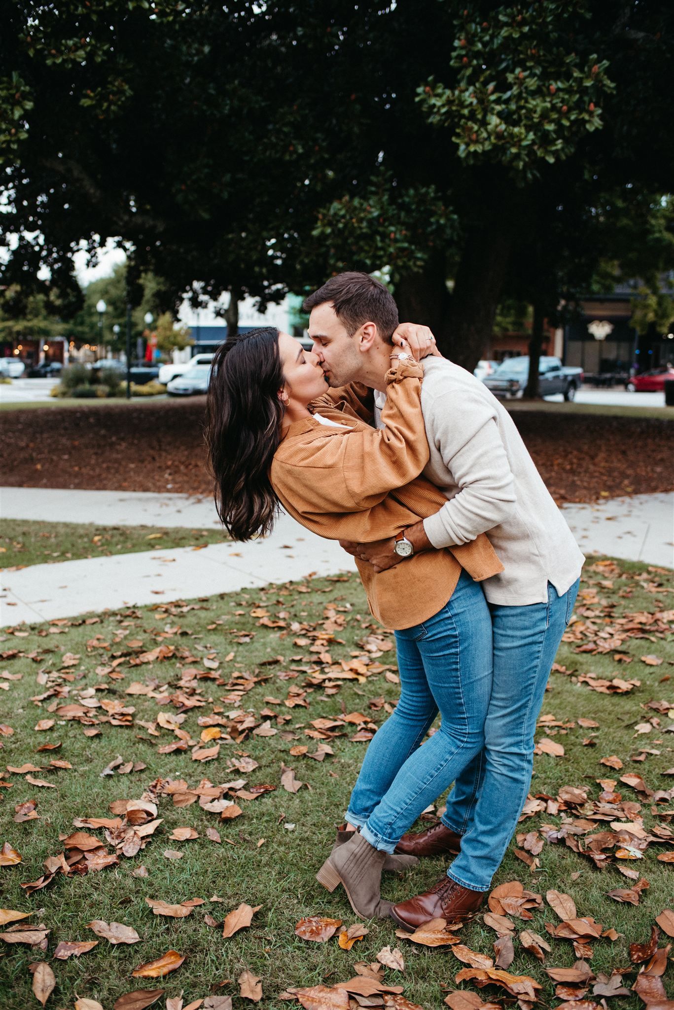 Couple hugging during a fall engagement session in Atlanta
