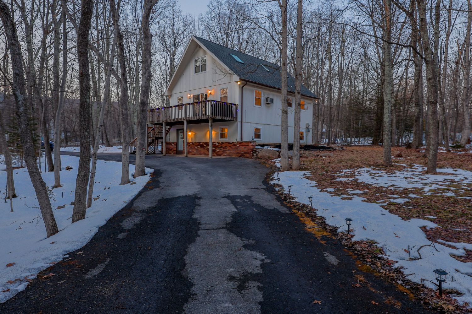 Real estate photography in the Poconos featuring house at twilight.