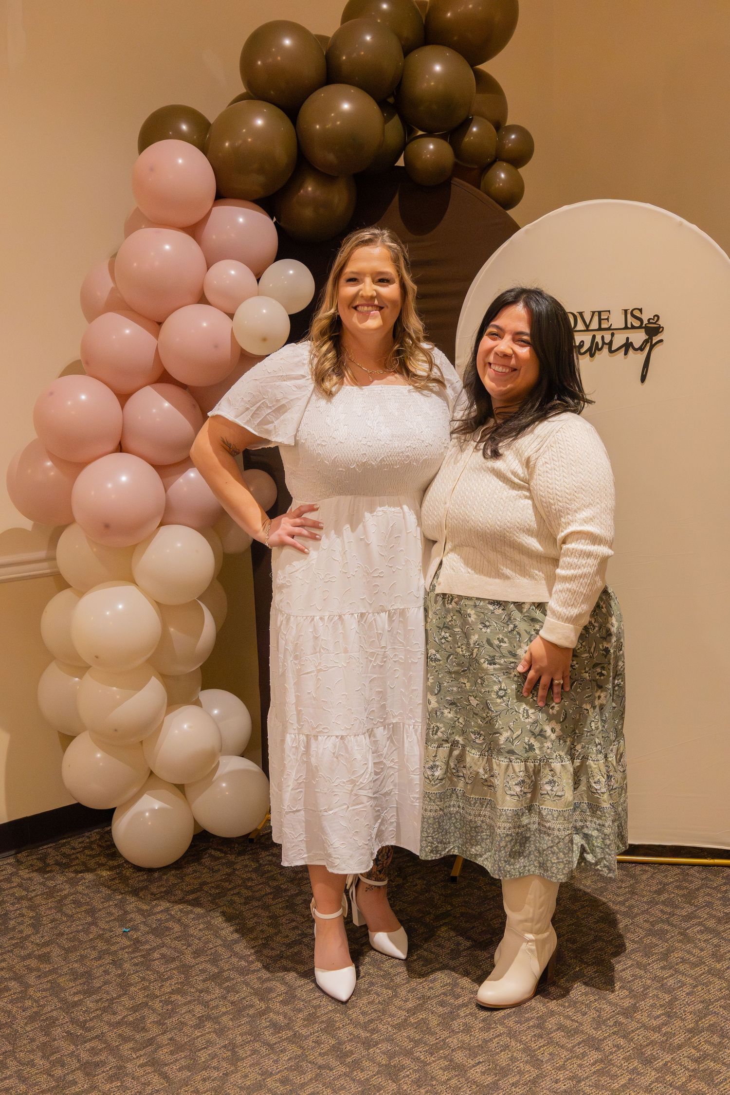 Bridal shower showcasing bride and friend posing for picture.