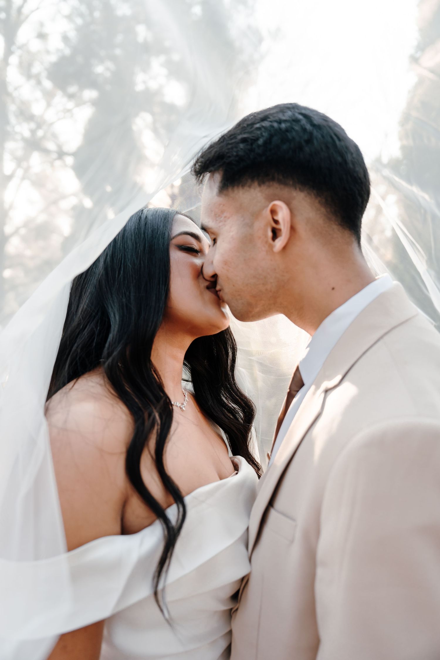Intimate wedding portraits of a couple sharing romantic moments in soft lighting.