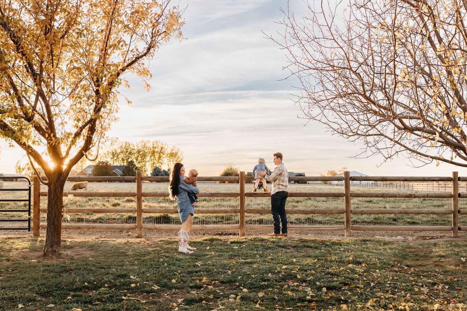 family on ranch in the fall during a western styled photoshoot