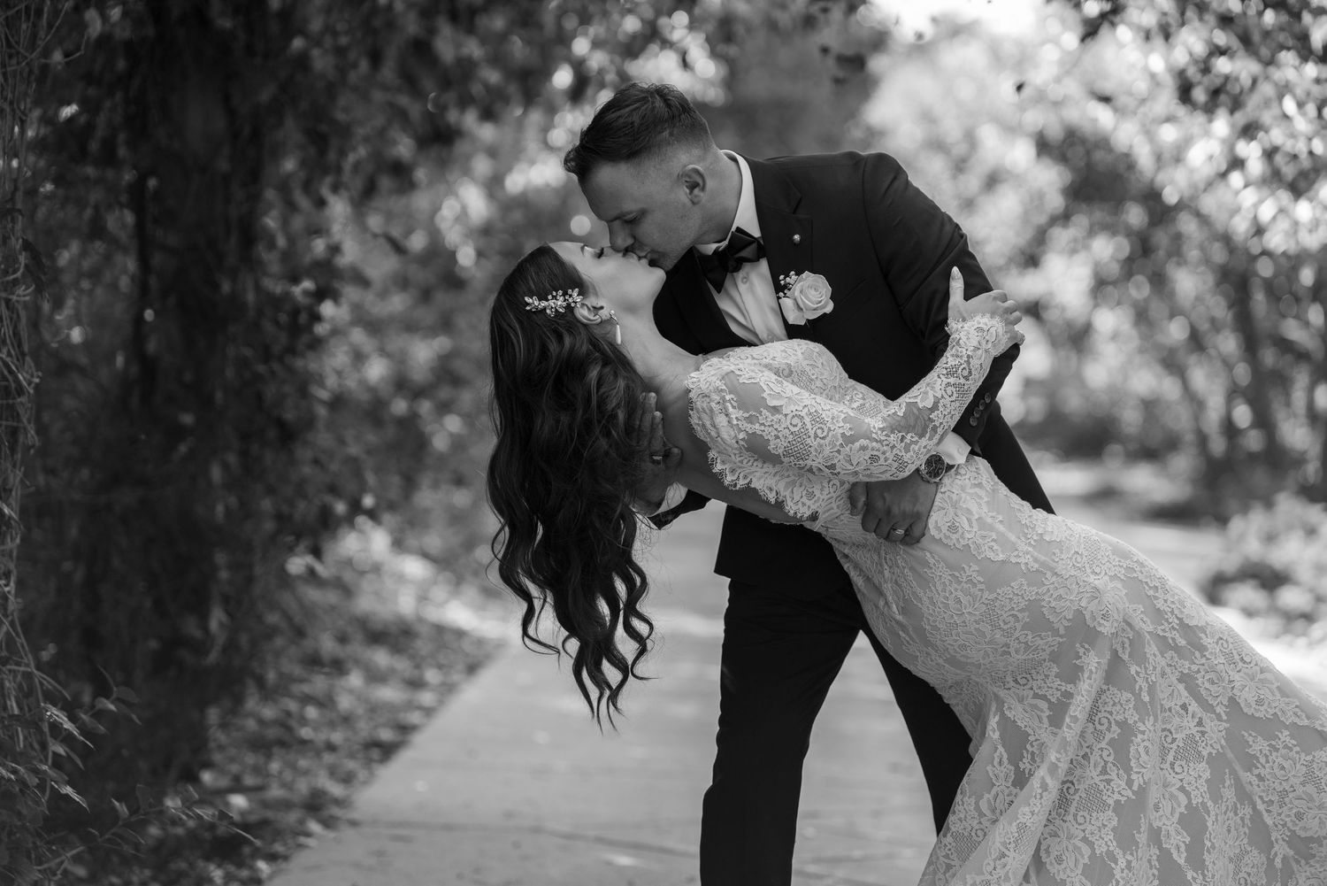 Romantic wedding photography session in a natural outdoor setting.