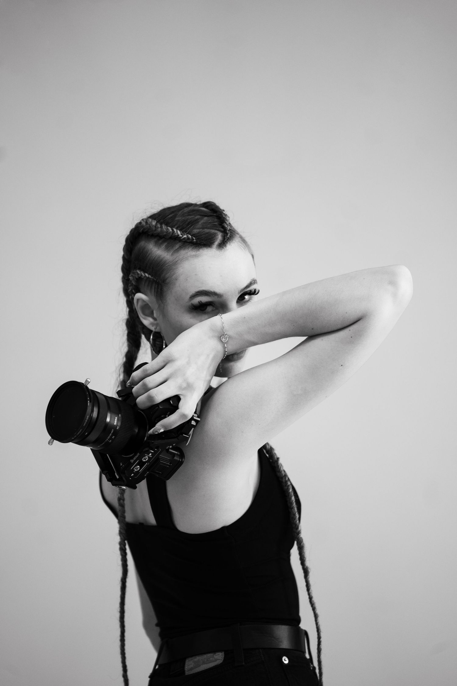 Artistic black and white portrait series showing expressive hand movements.
