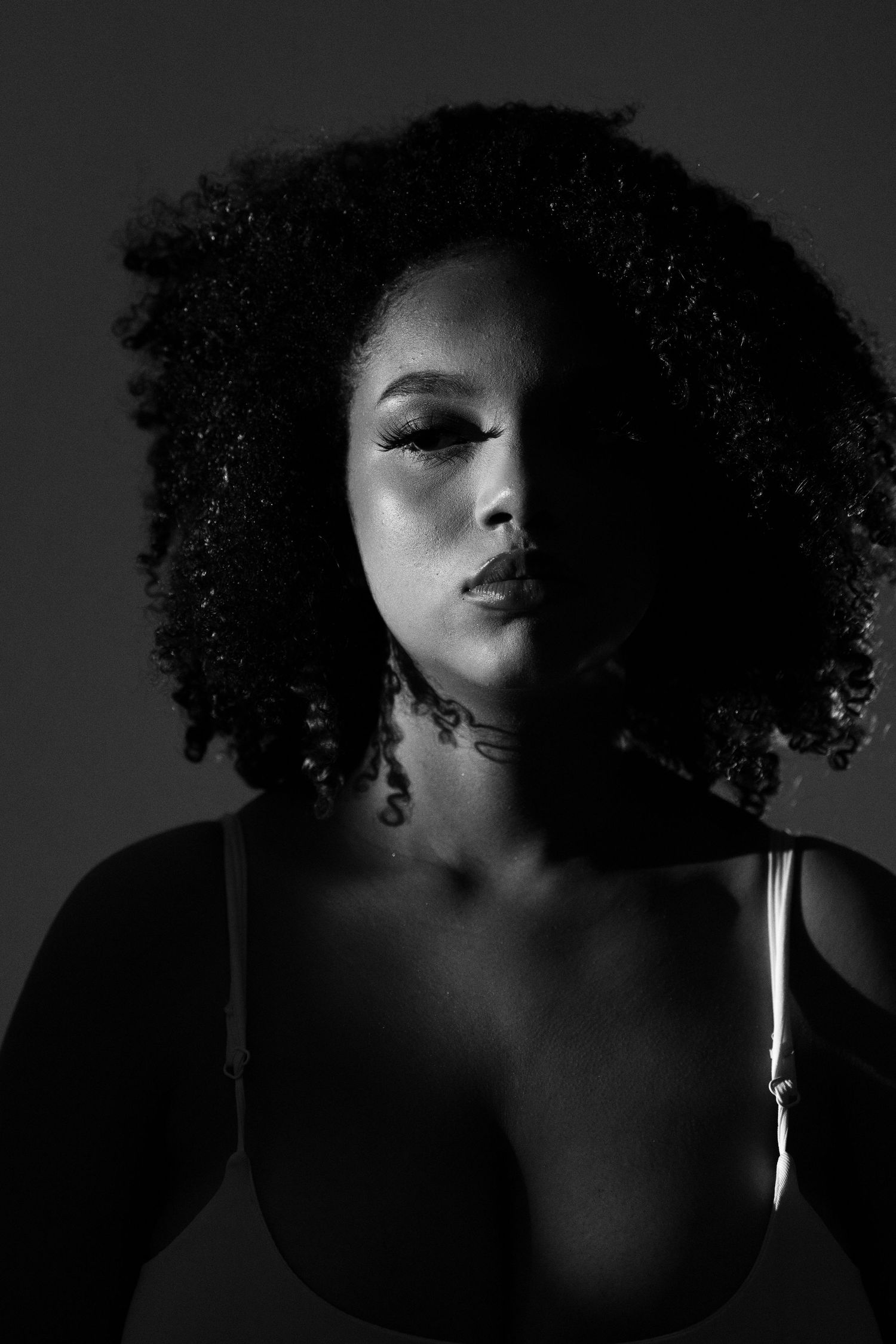 Series of artistic black and white close-up shots with dramatic shadows.