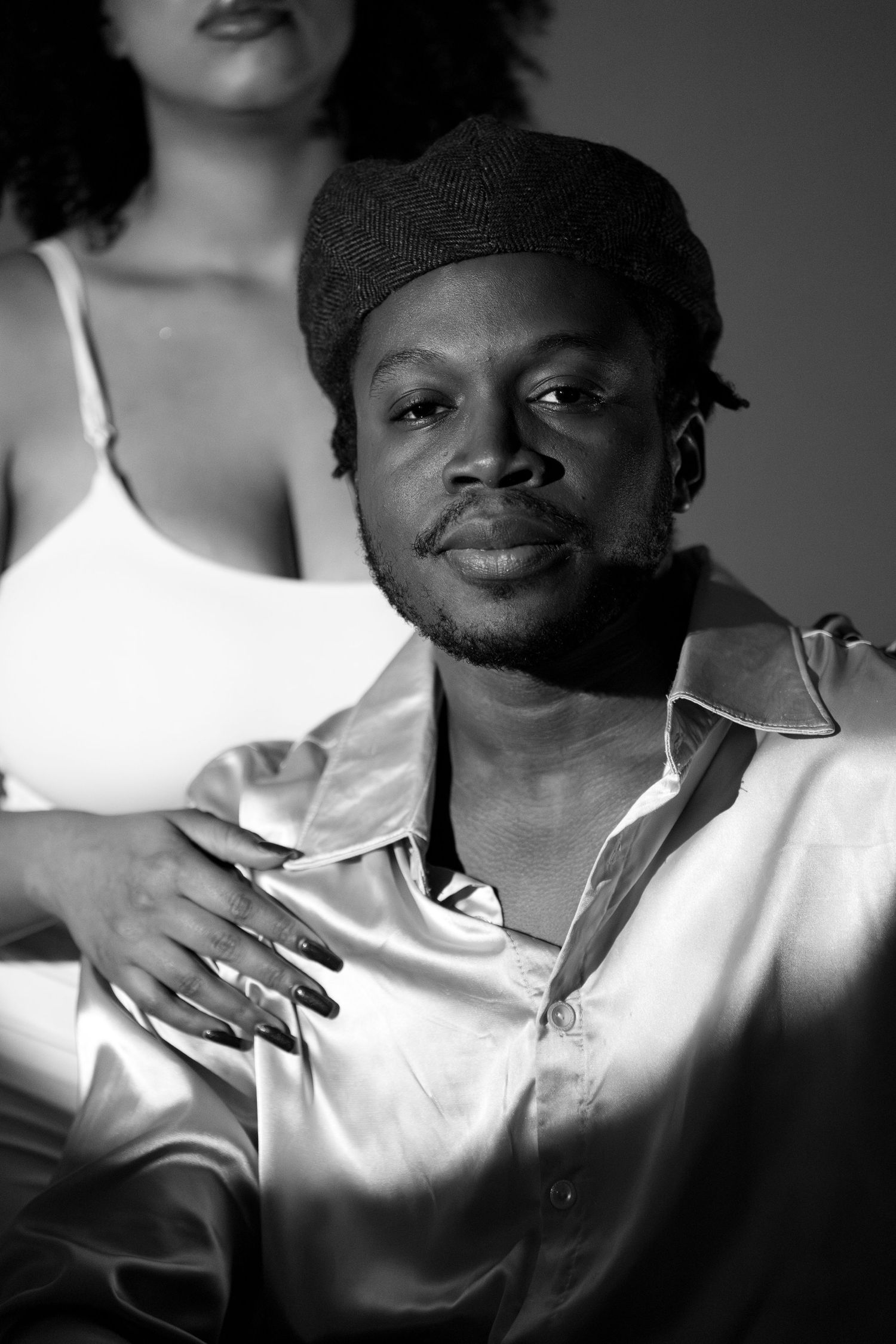 Black and white portraits showing contrasting light on white clothing.