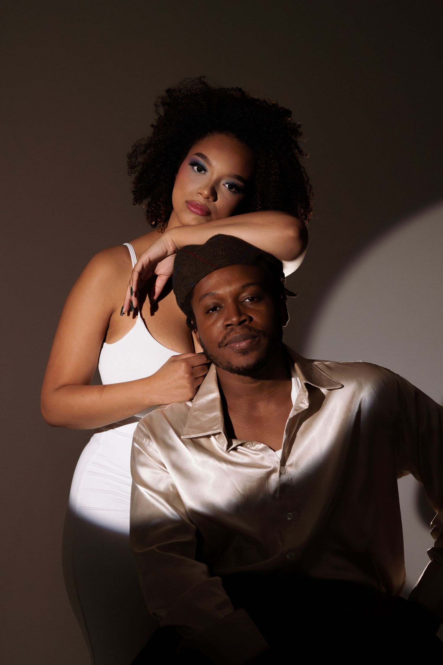 Intimate studio portraits with contrasting light and shadow effects.