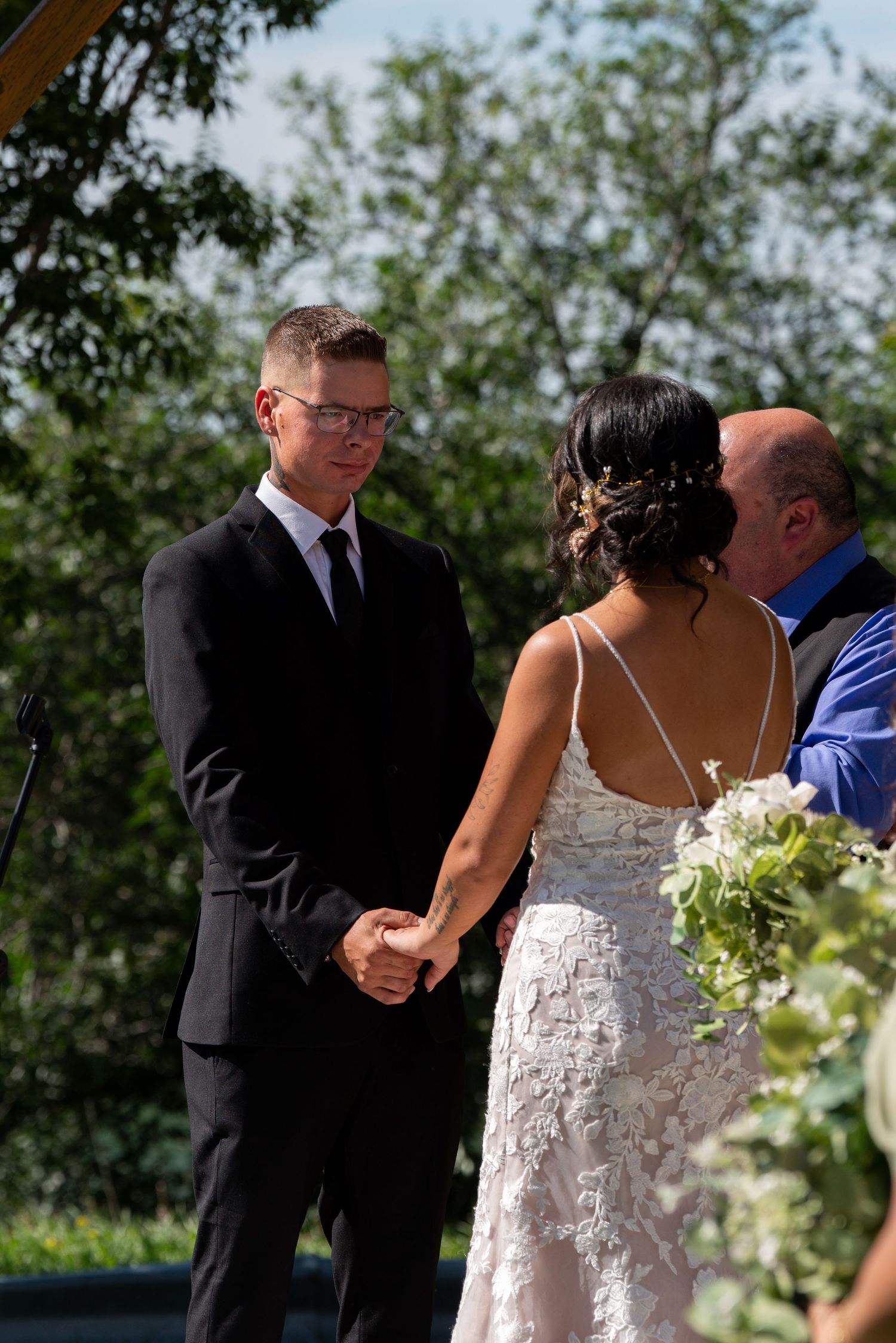 Wedding ceremony in a garden setting with elegant floral arrangements.