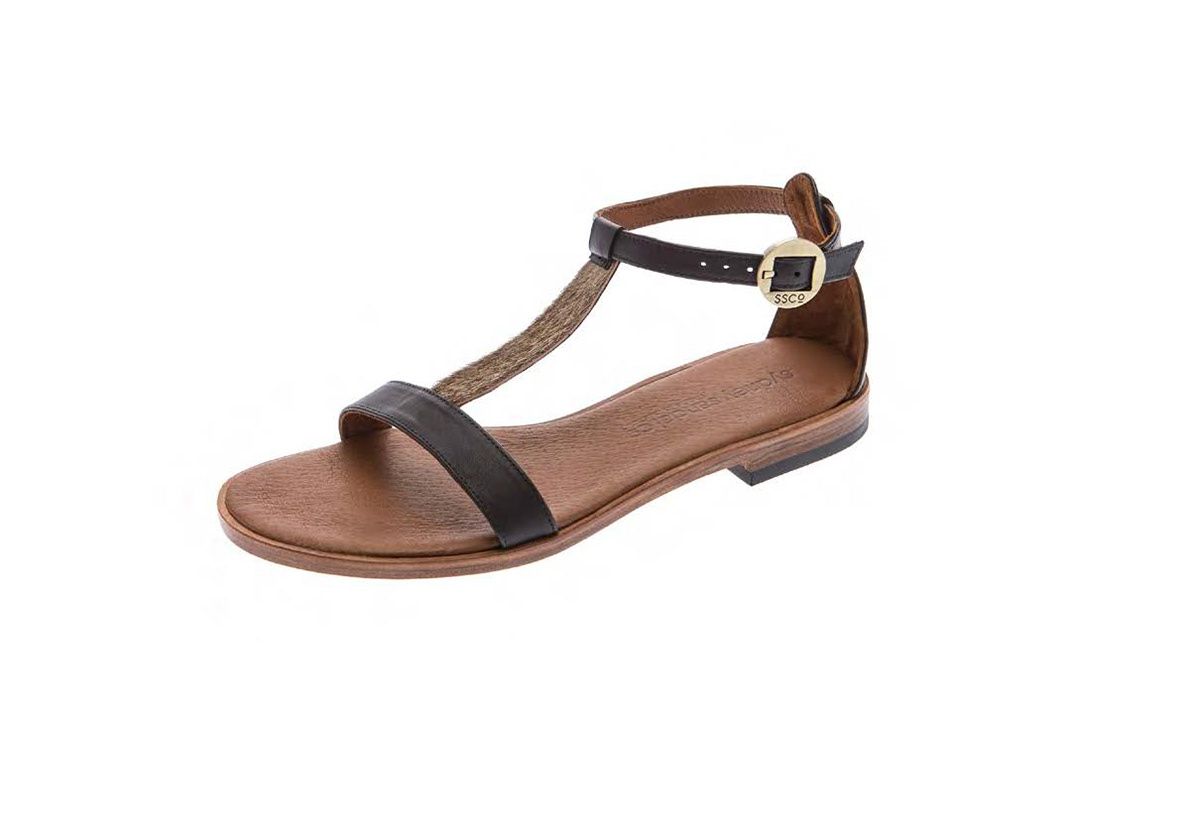 Women's flat T-strap sandals in black and tan leather with gold buckle closure.
