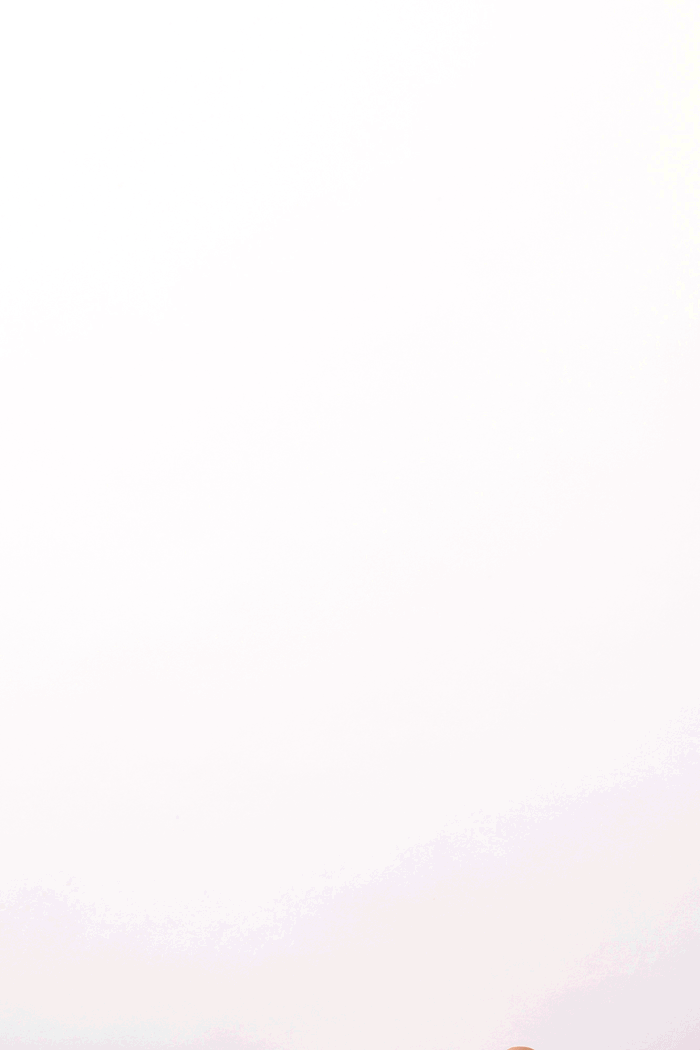 Minimalist white background with subtle soft pastel gradient at bottom edge.